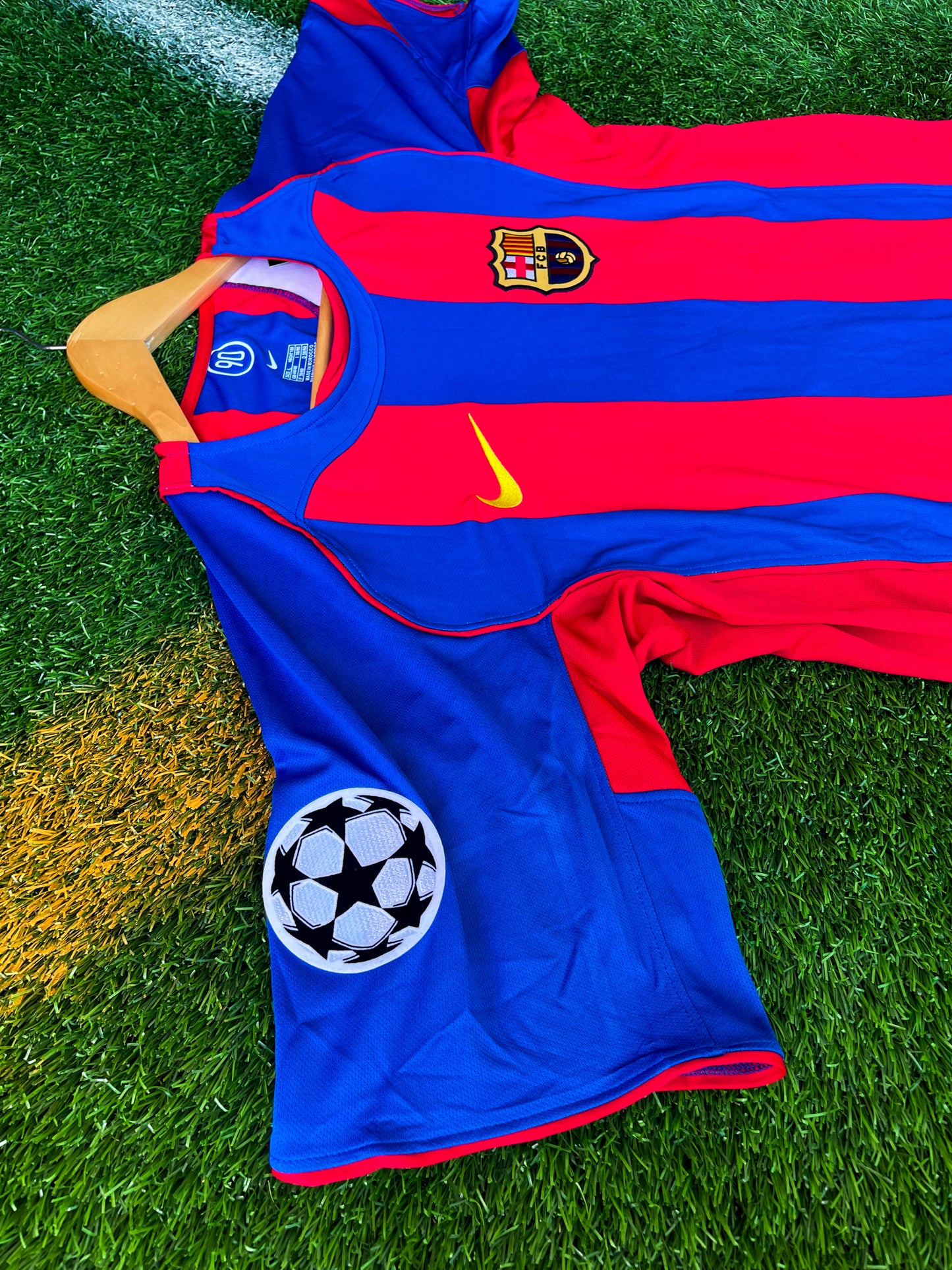 Close-up of embroidered crest and Nike logo on 2004-2005 kit