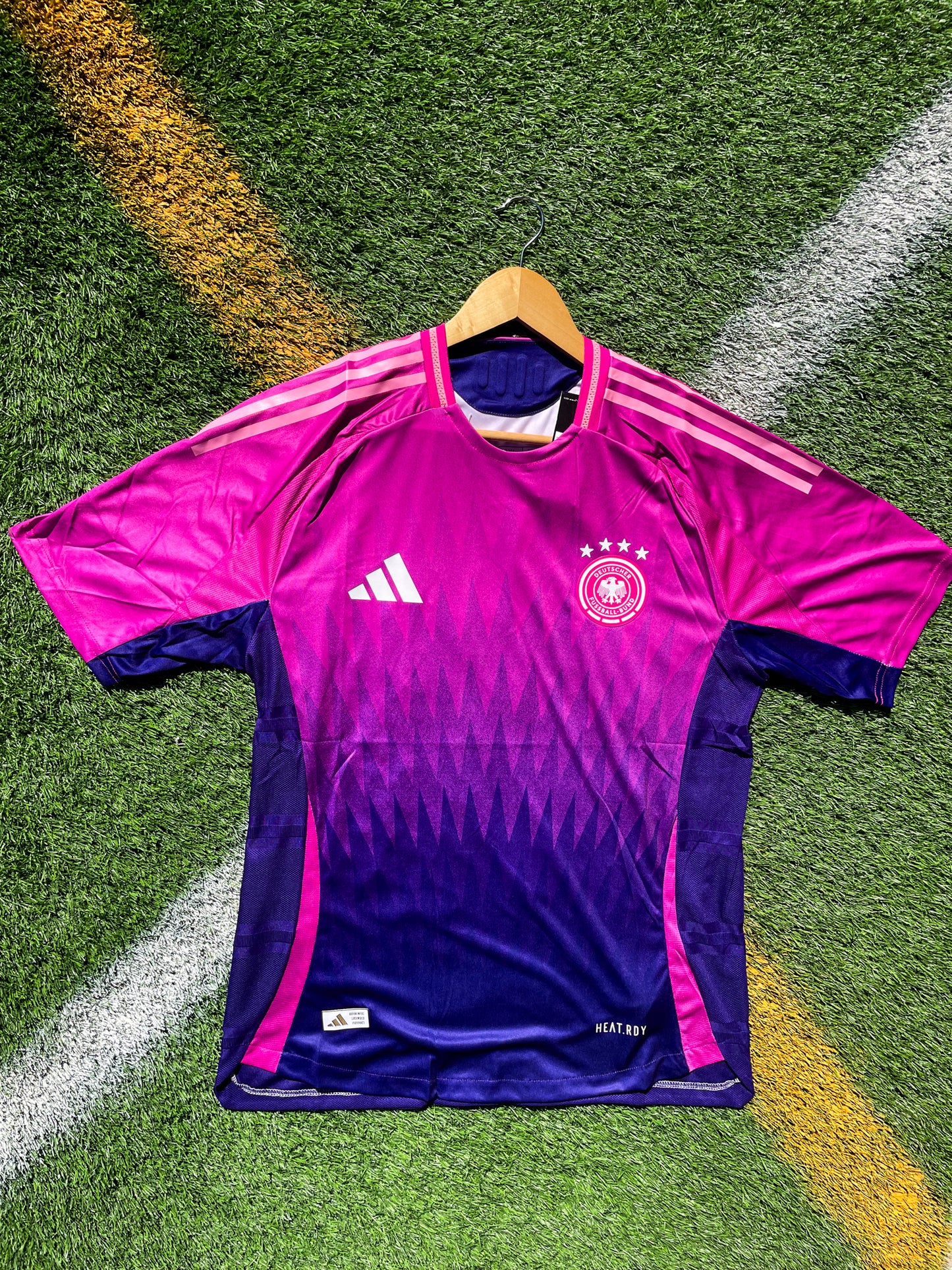Front of Germany 2024 away jersey with pink-to-purple gradient design