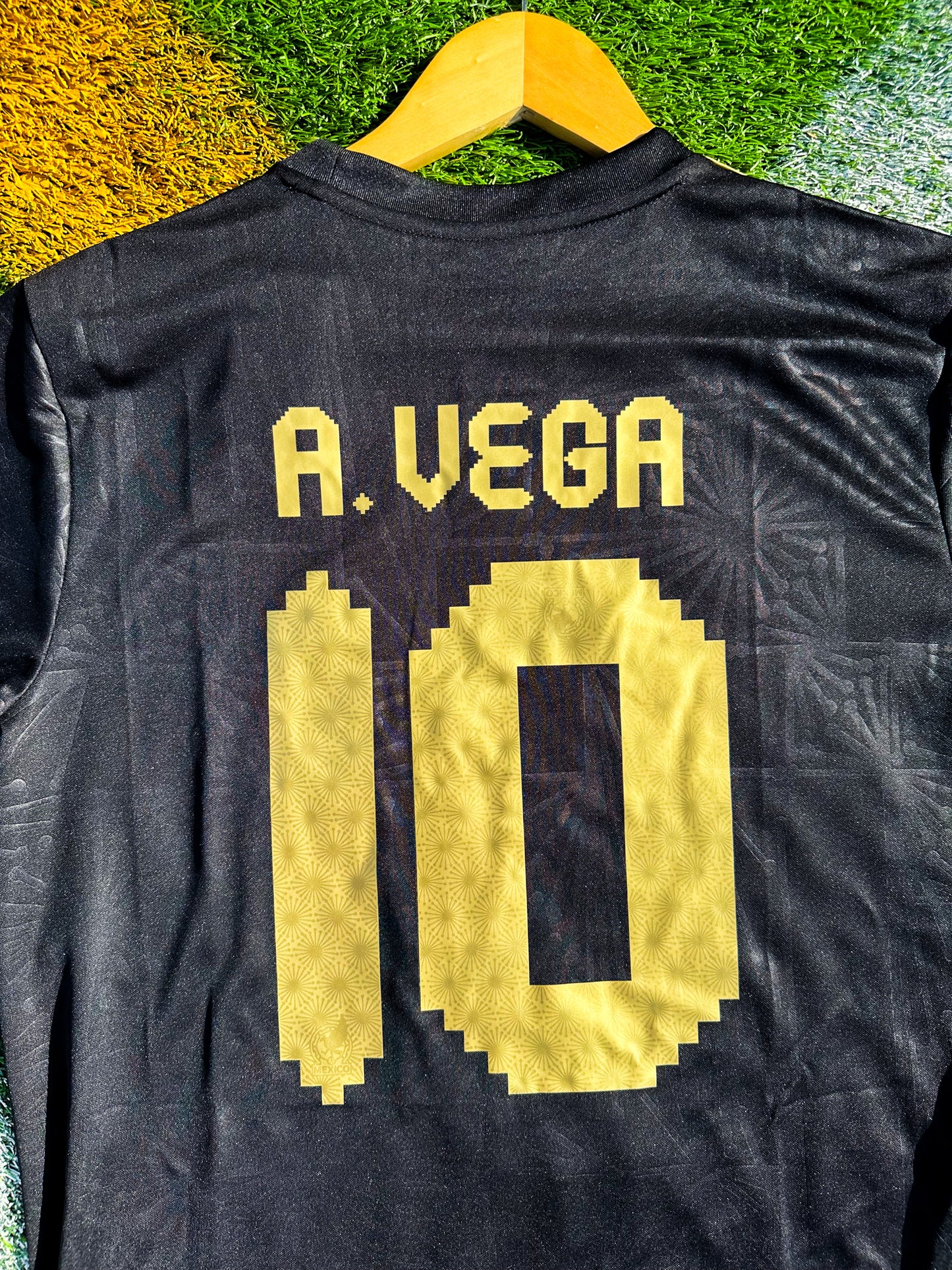 Back view showing A Vega #10 print on black jersey