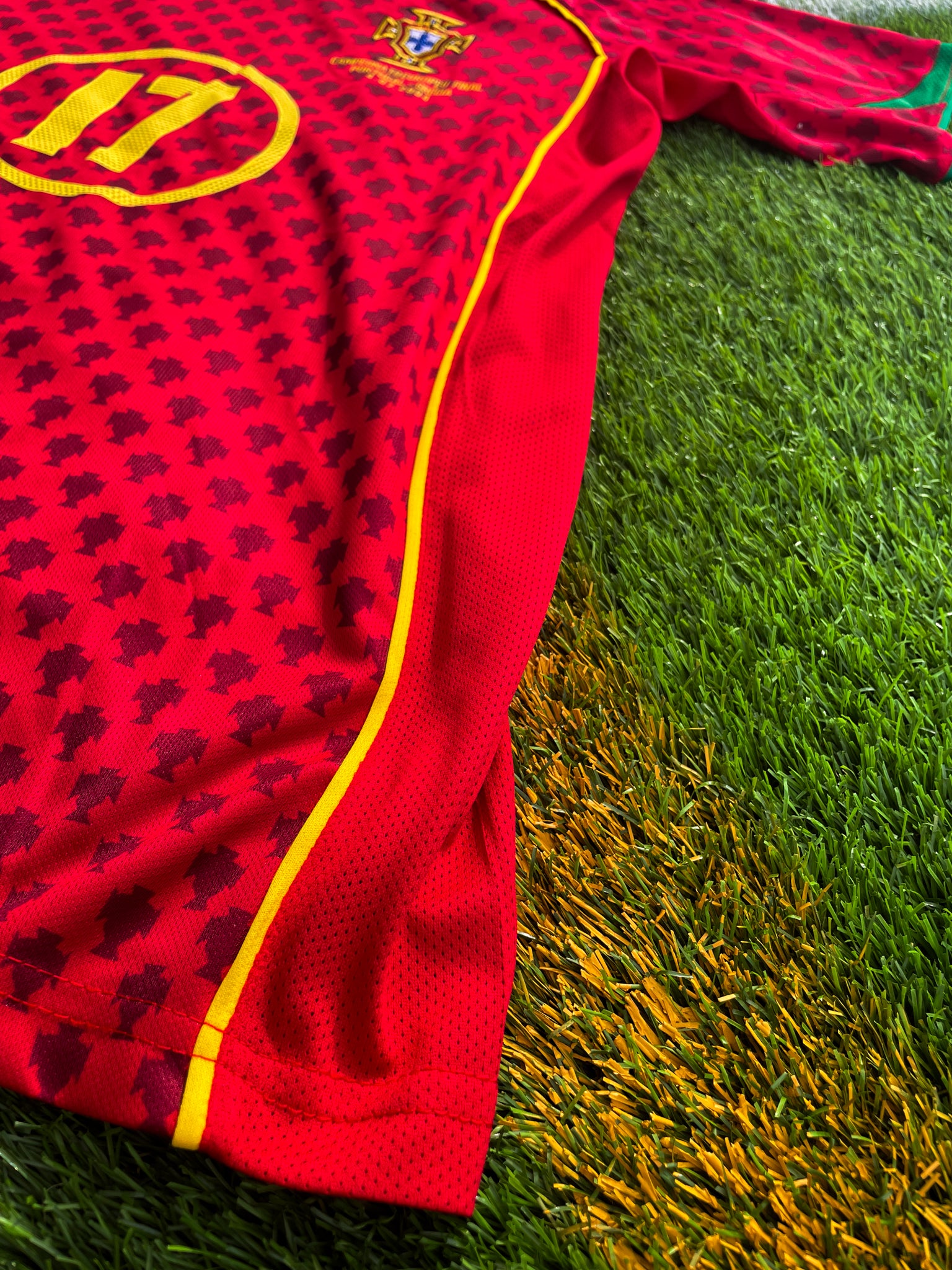 Close-up of Nike swoosh and Portuguese crest

