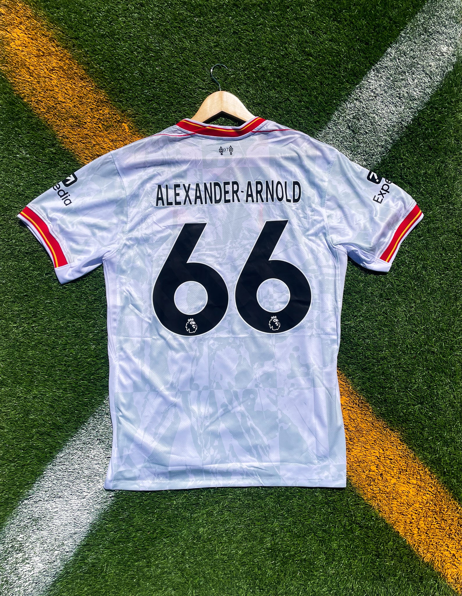 Back view showing Salah #11 or Alexander-Arnold #66 on white kit

