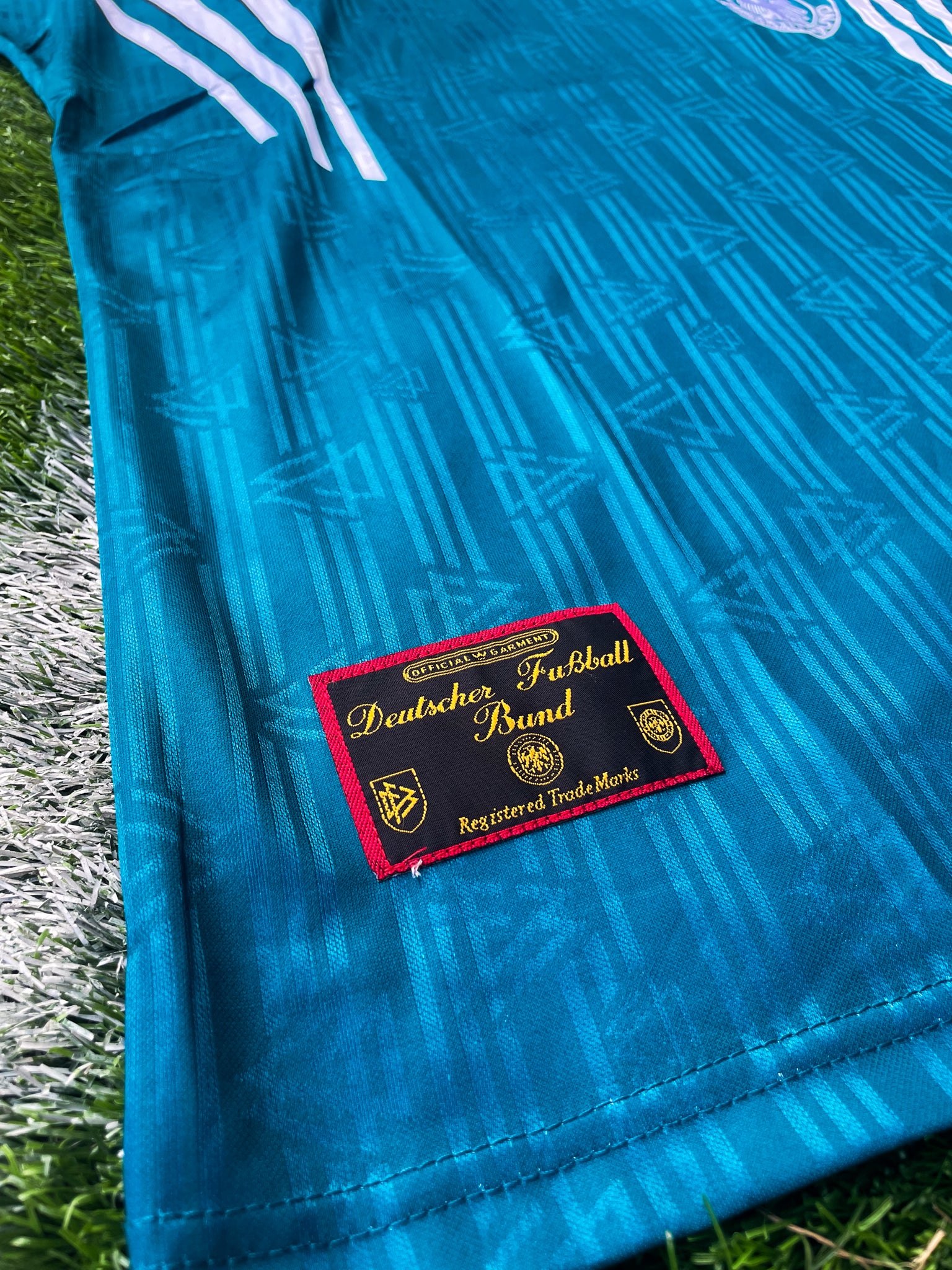 Close-up of DFB crest and Adidas logo

