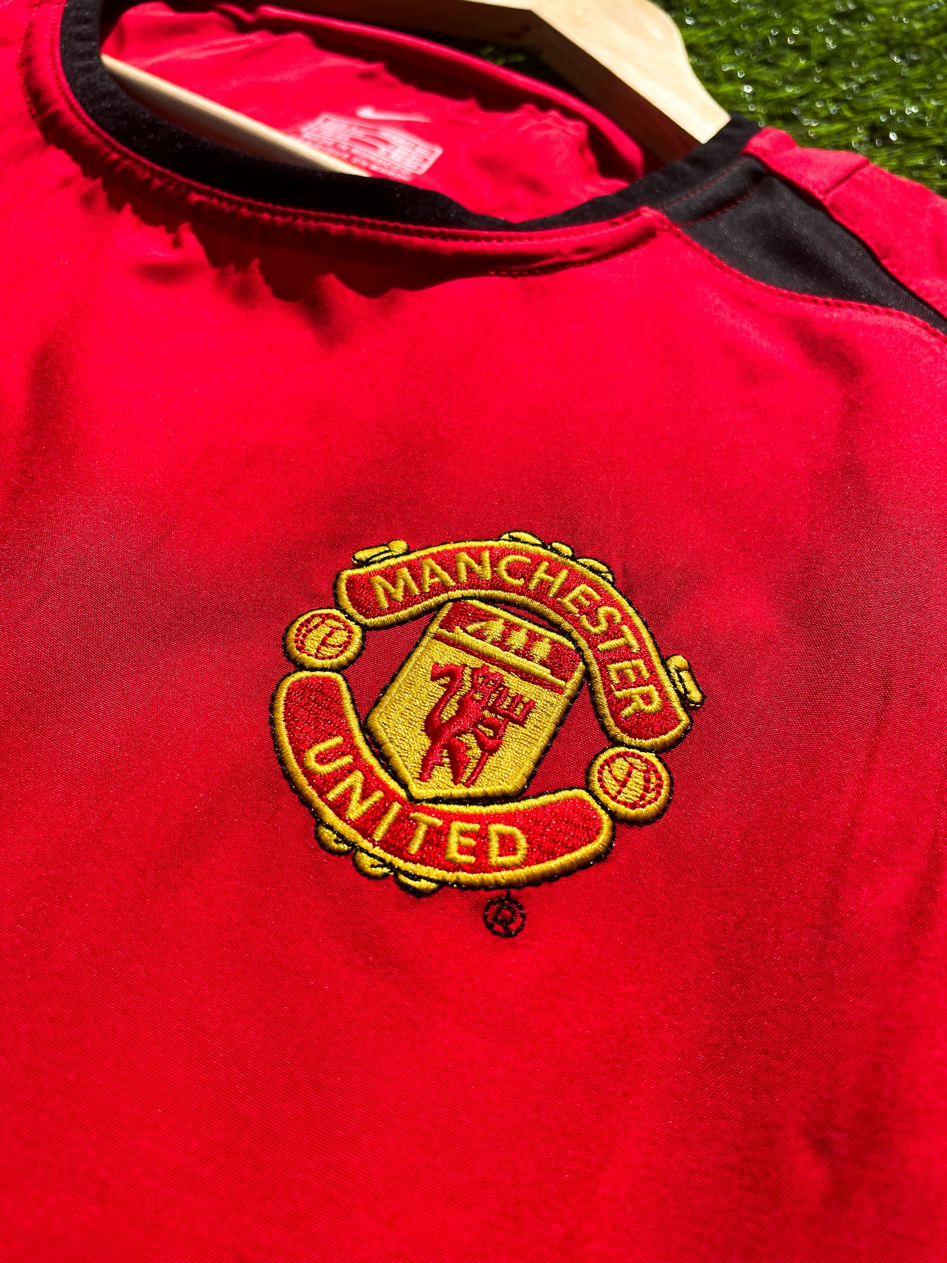 Close-up of embroidered club crest and Nike swoosh

