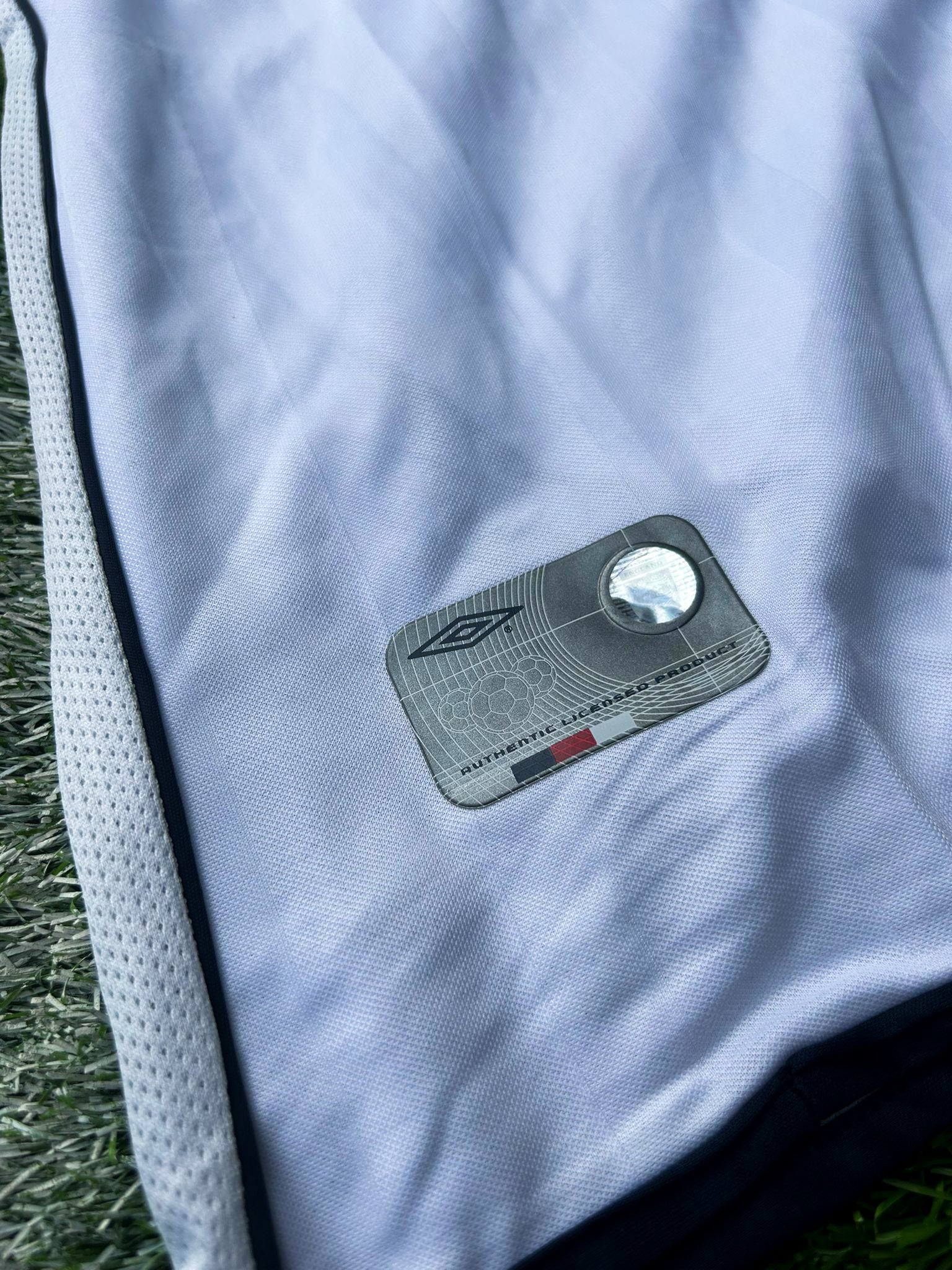 Close-up of the umbro crest and jersey fabric details.