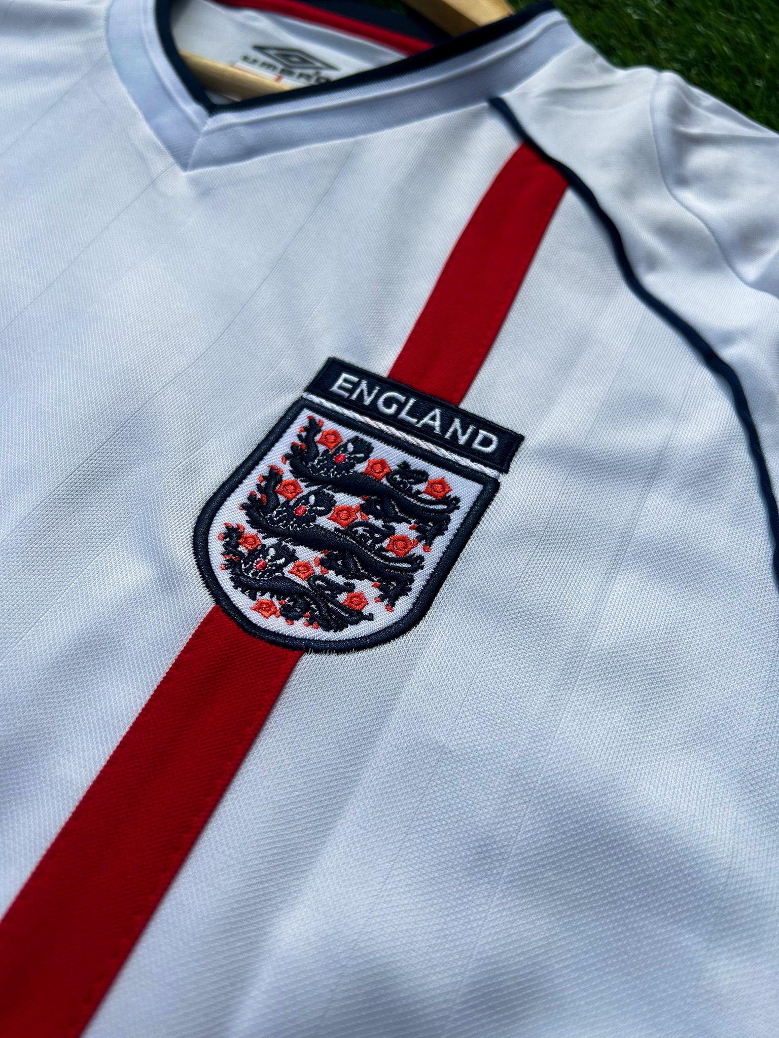 Close-up of the England crest and jersey fabric details.