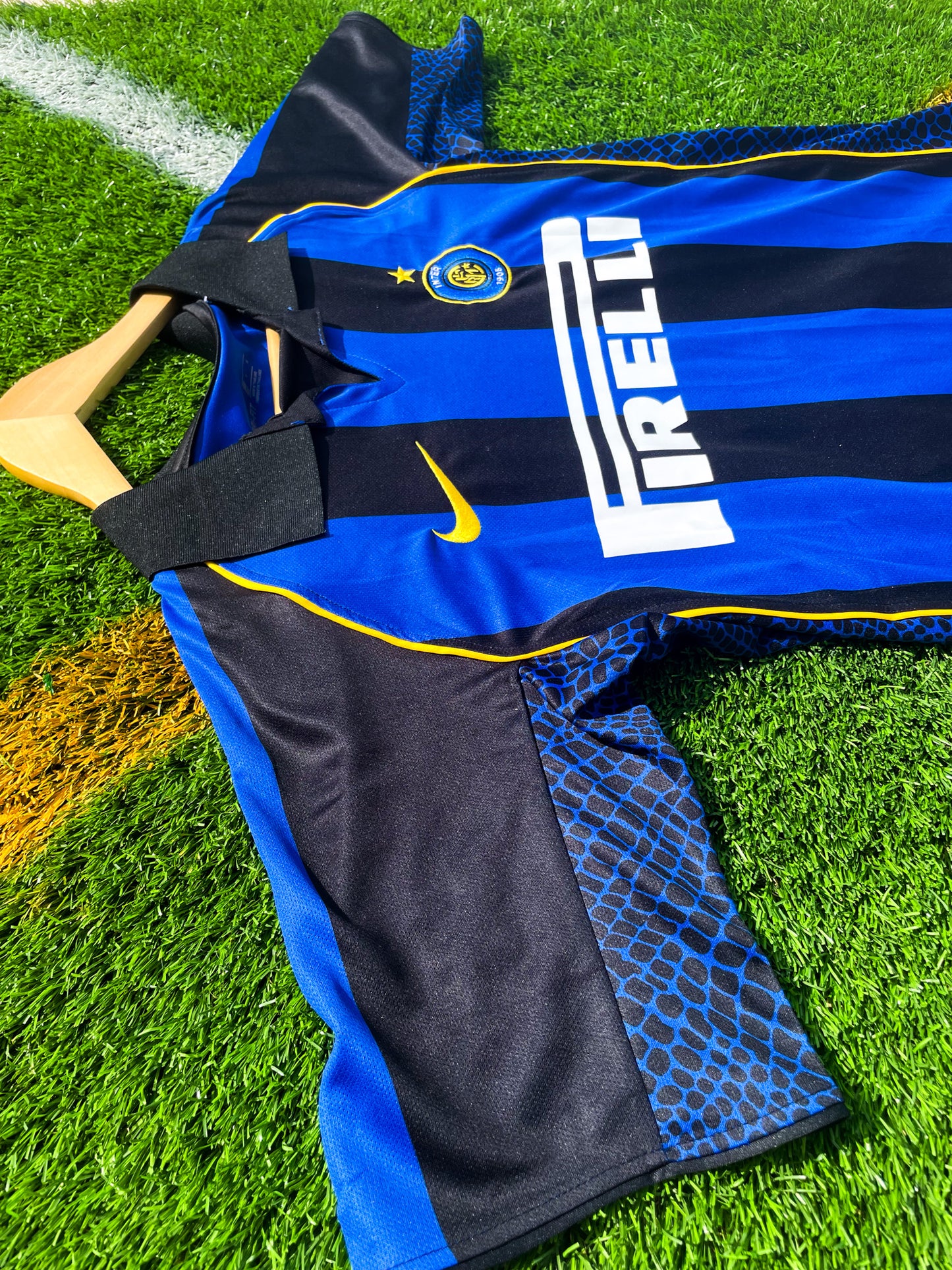 Close-up of Nike logo, Inter crest, and Pirelli sponsor

