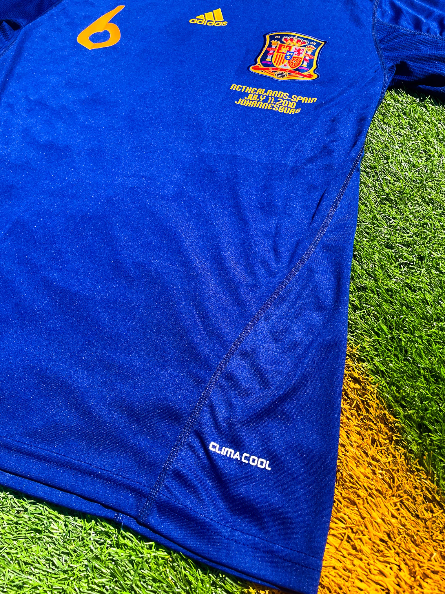 Detail shot of Spain crest and Adidas logo from 2010 Away kit

