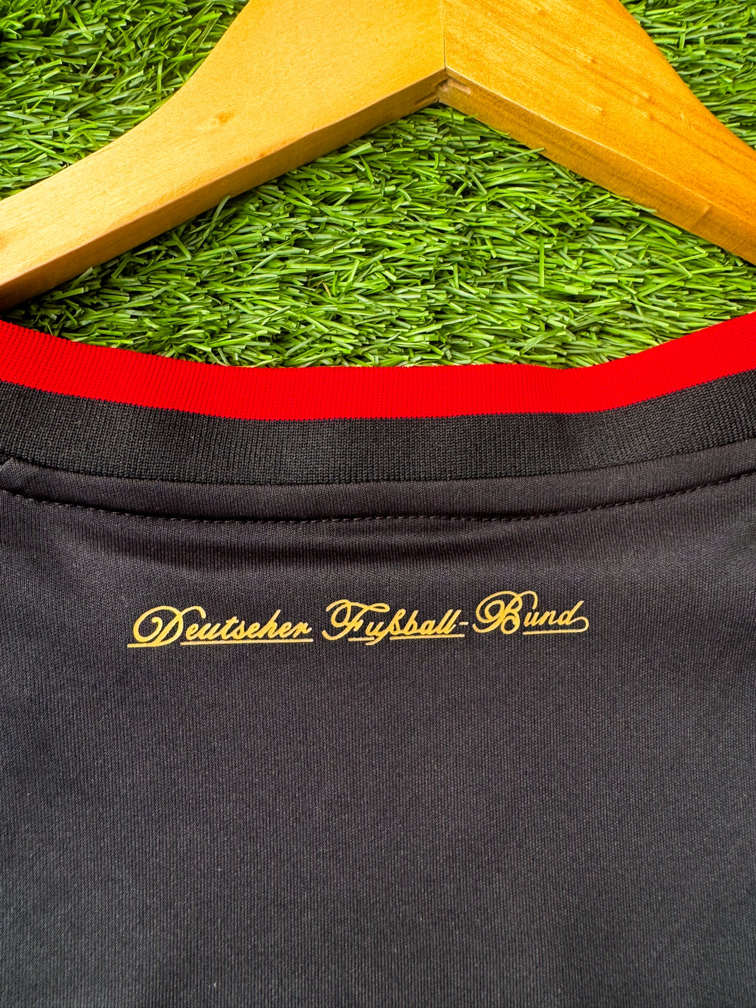 Close-up of Adidas logo and DFB crest

