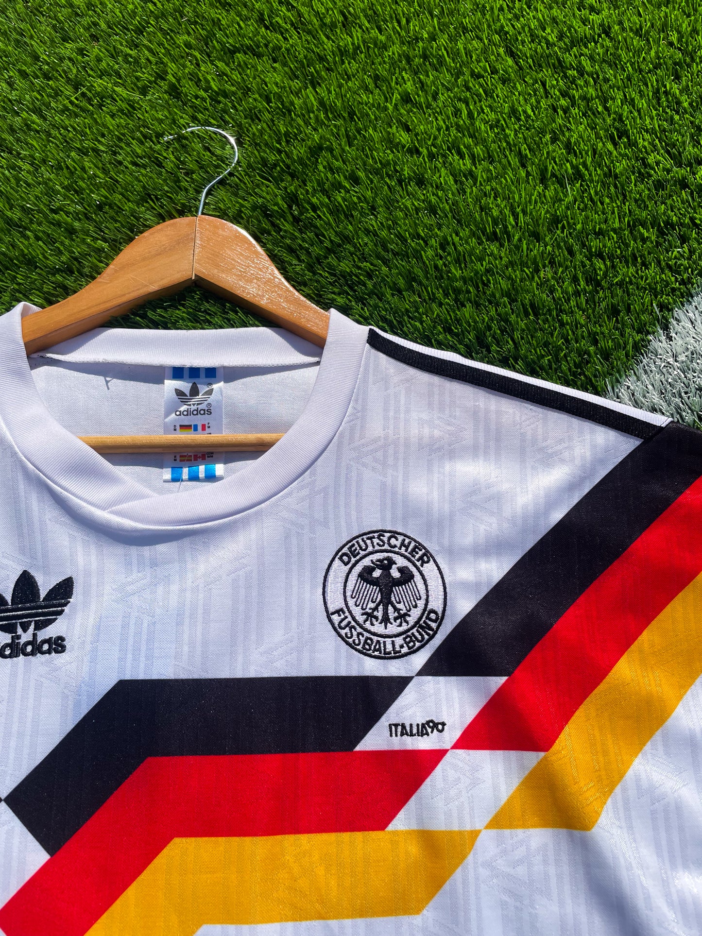 Close-up of DFB crest and Adidas shoulder logo

