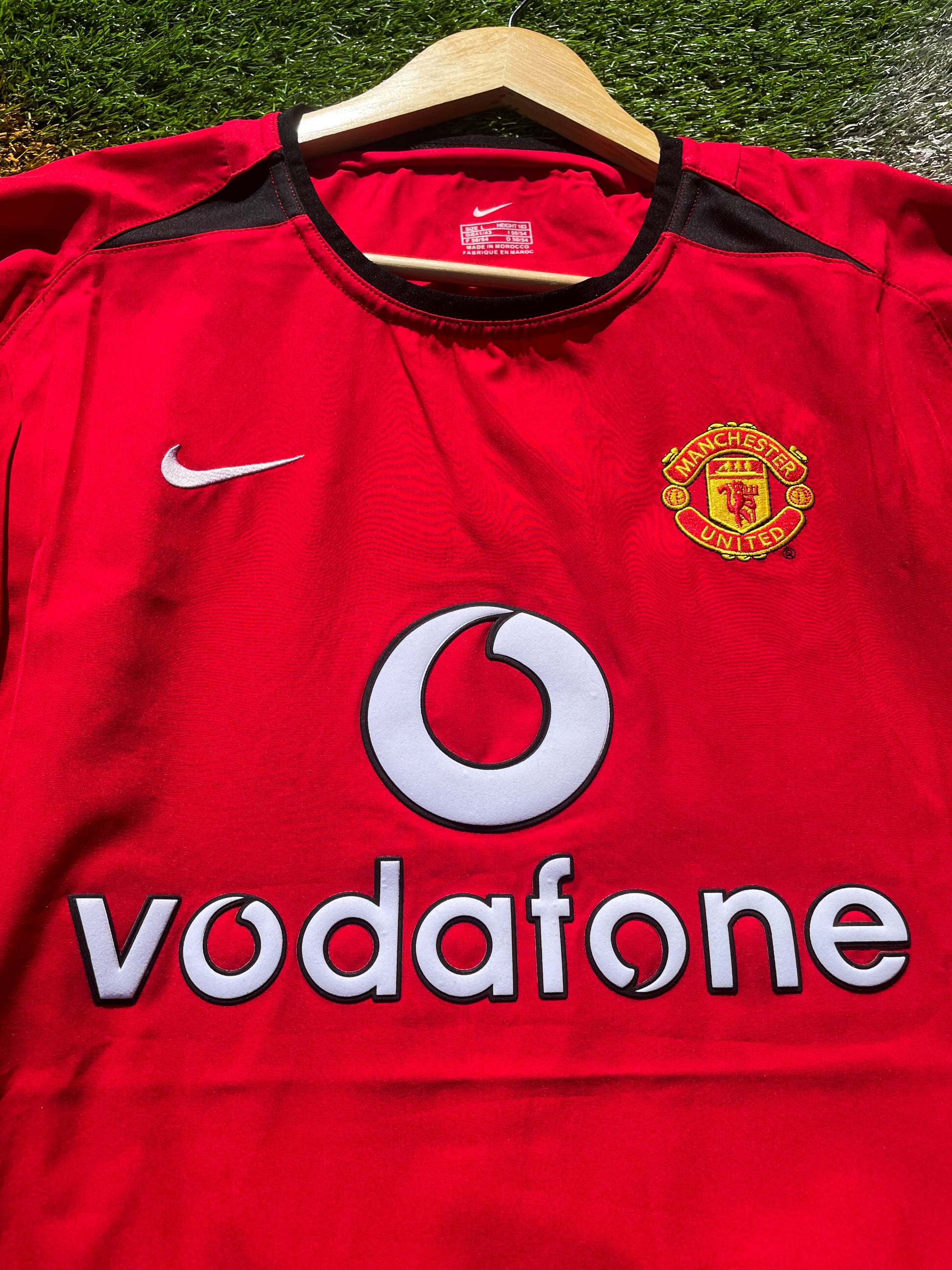 Close-up of embroidered club crest and Nike swoosh

