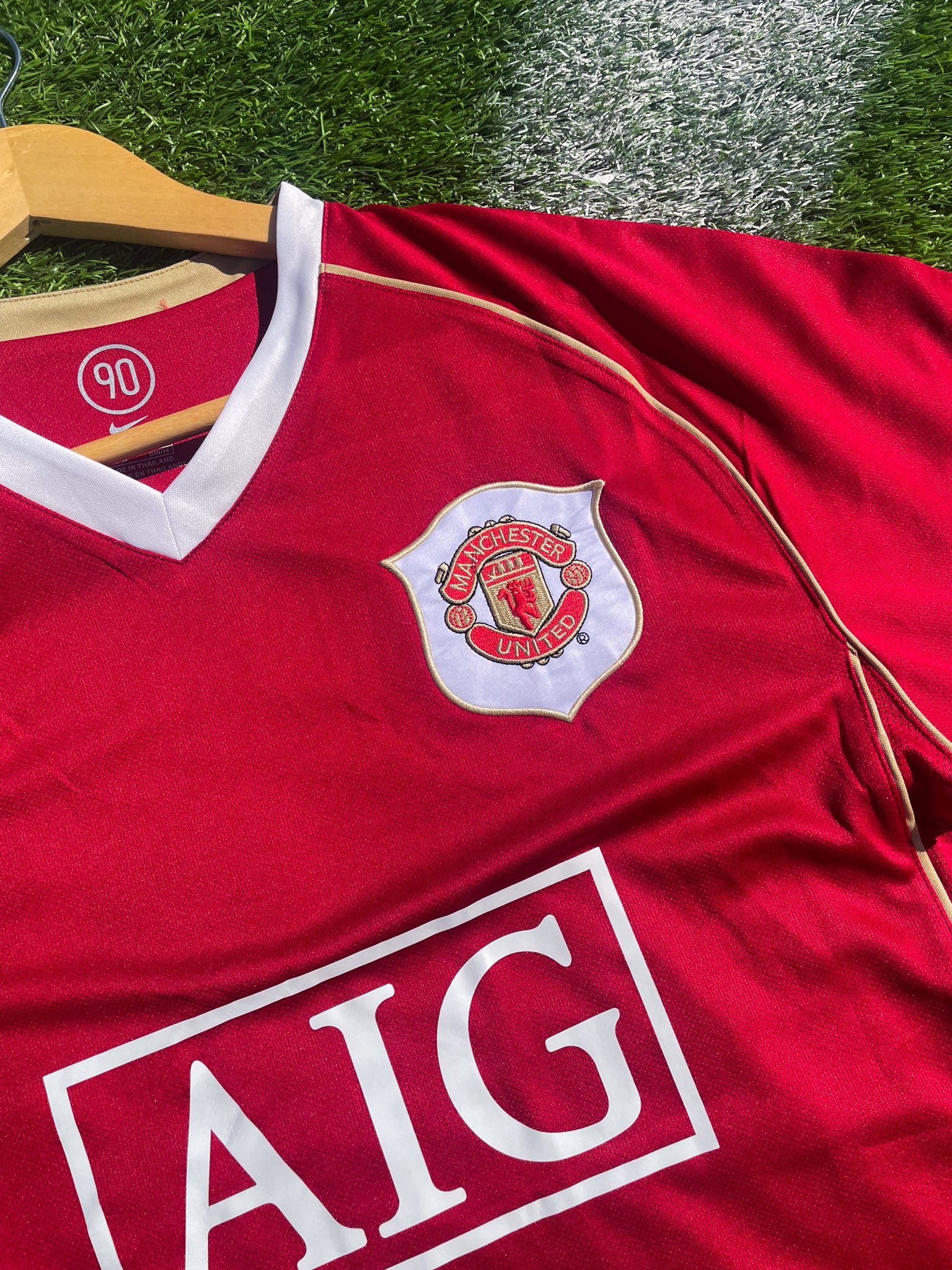 Close-up of Nike swoosh and embroidered crest

