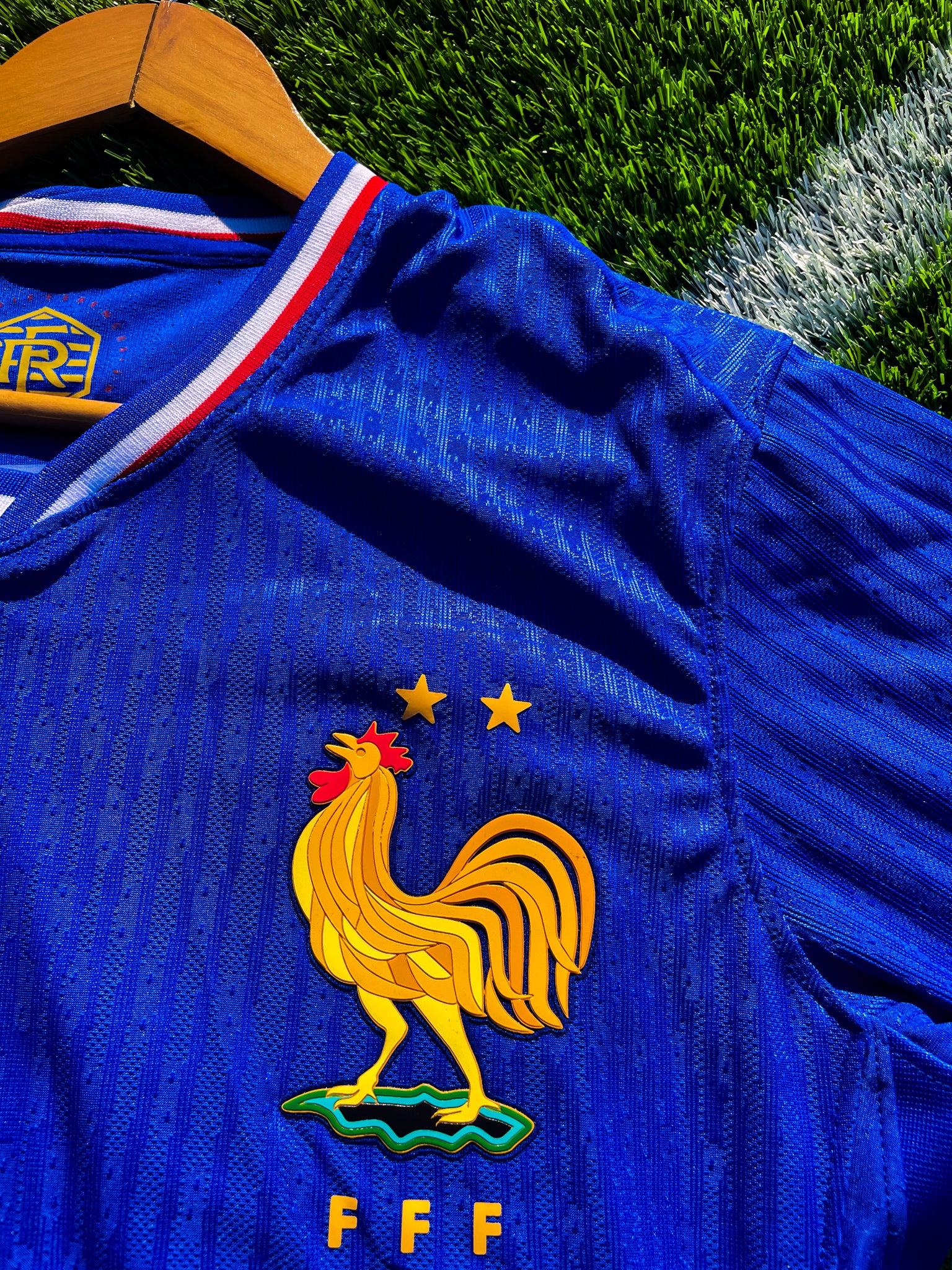 Close-up of France crest and Nike logo on jersey

