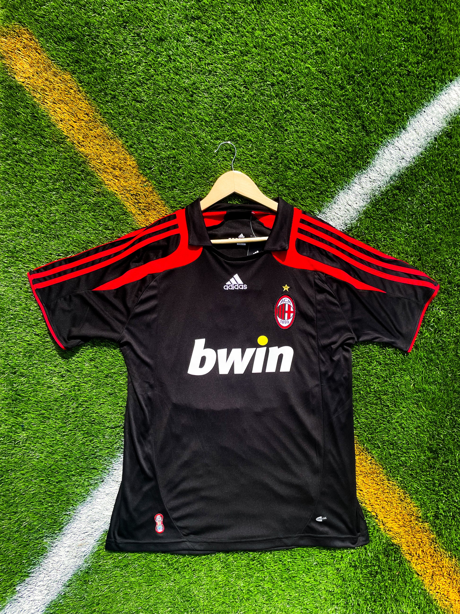 Front view of AC Milan 2007-08 Third Kaká #22 jersey in black with red accents

