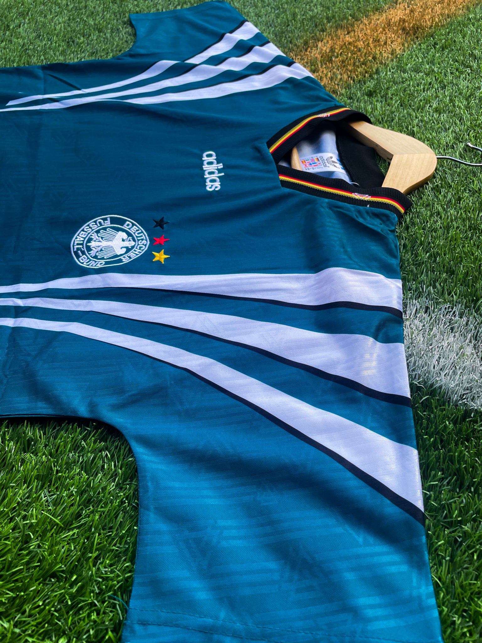 Close-up of DFB crest and Adidas logo

