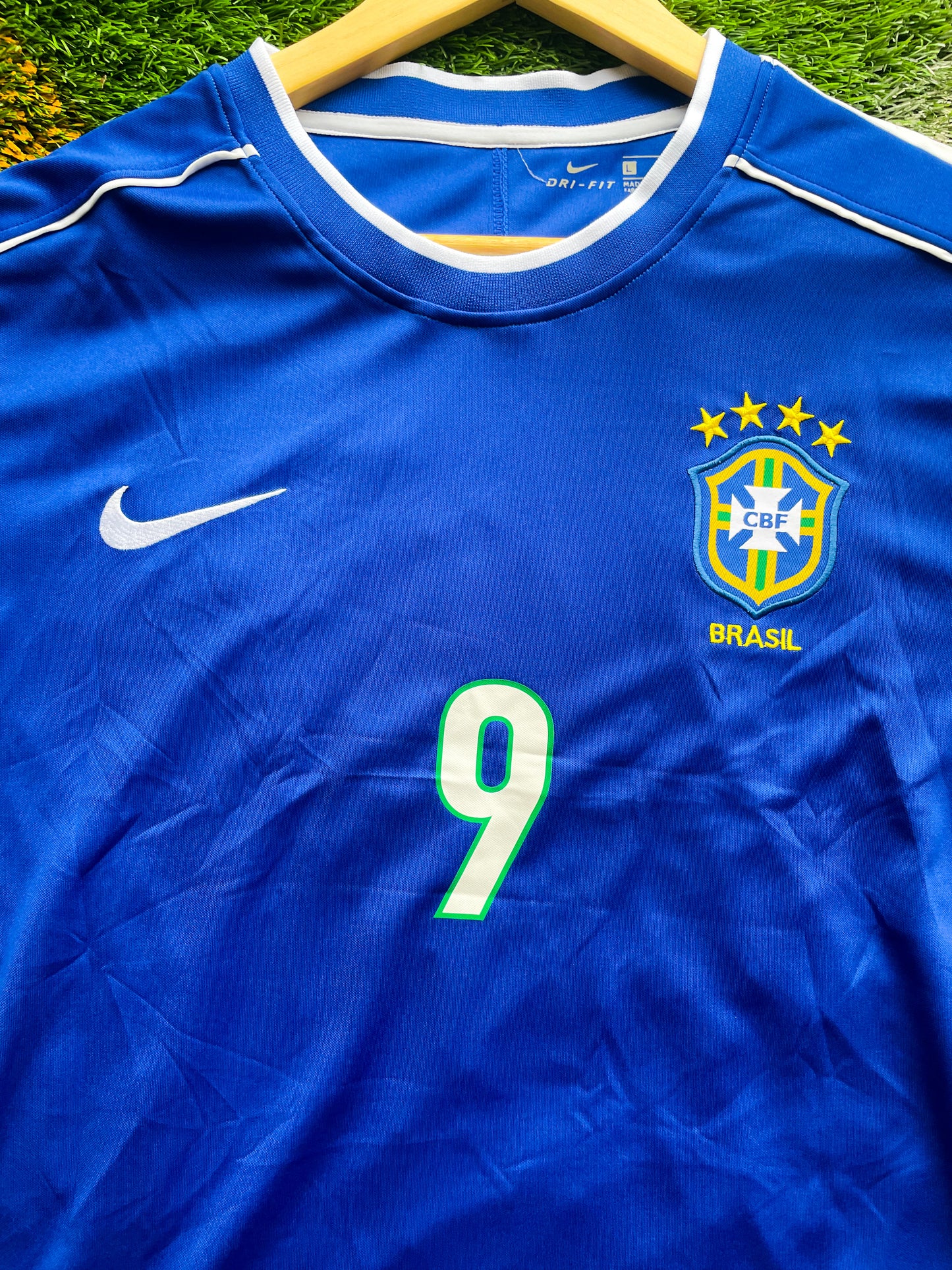 Close-up of embroidery and Nike swoosh on retro Brazil jersey