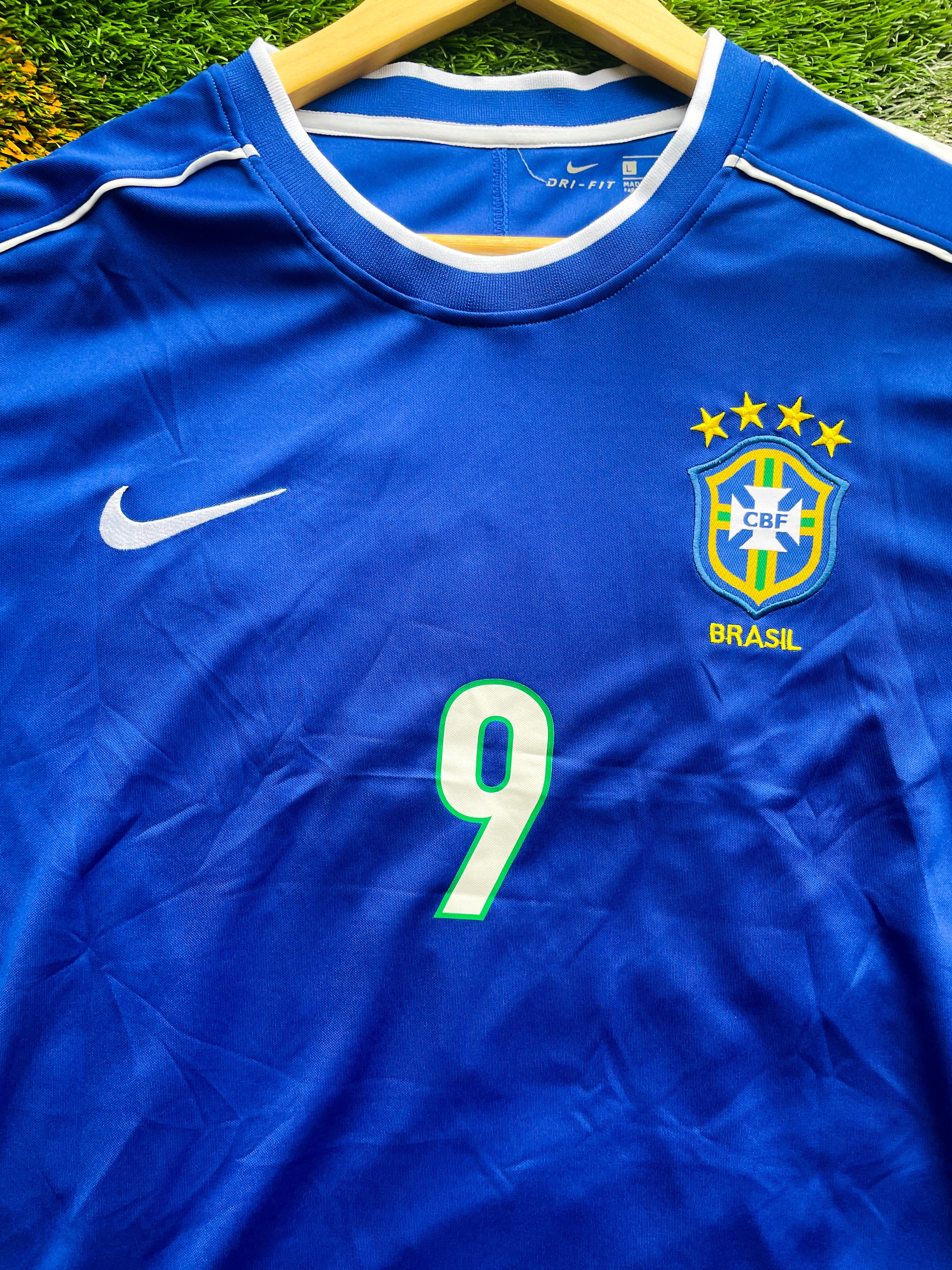 Close-up of embroidery and Nike swoosh on retro Brazil jersey