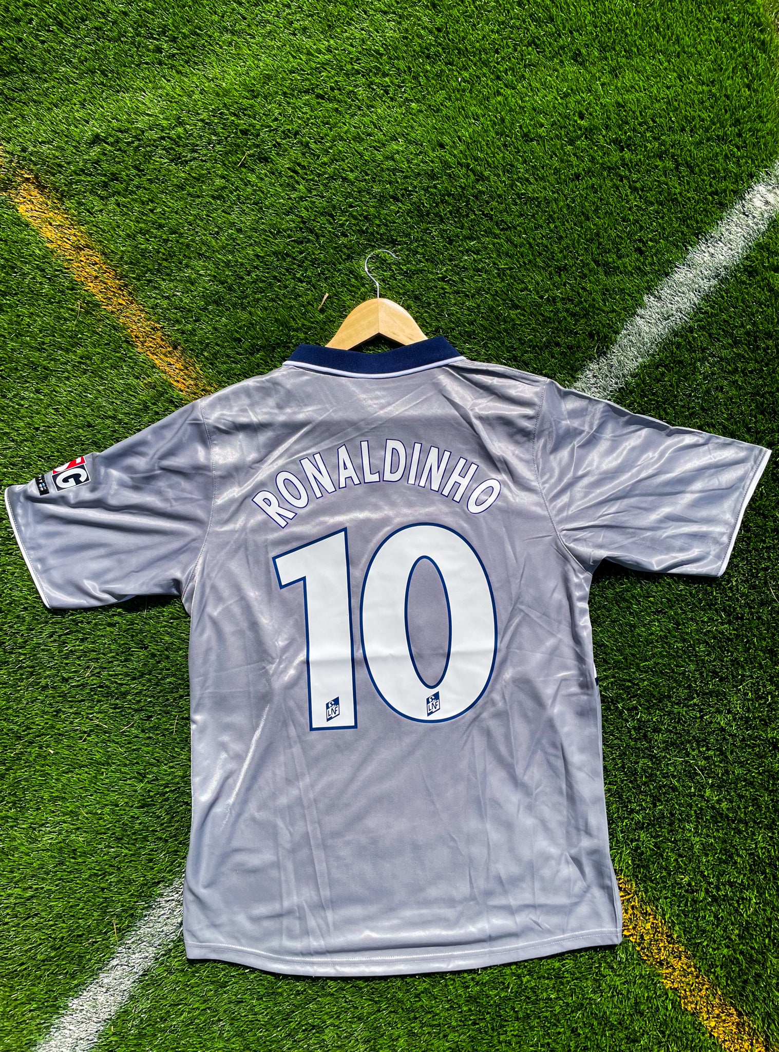Back view showing Ronaldinho #10 on silver-grey fabric

