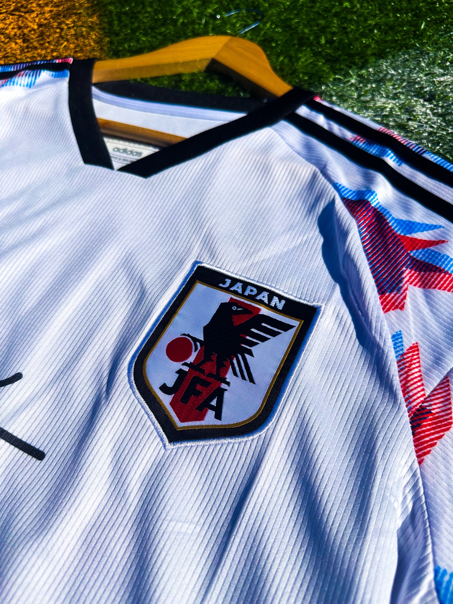 Close-up of Naruto graphic and JFA crest

