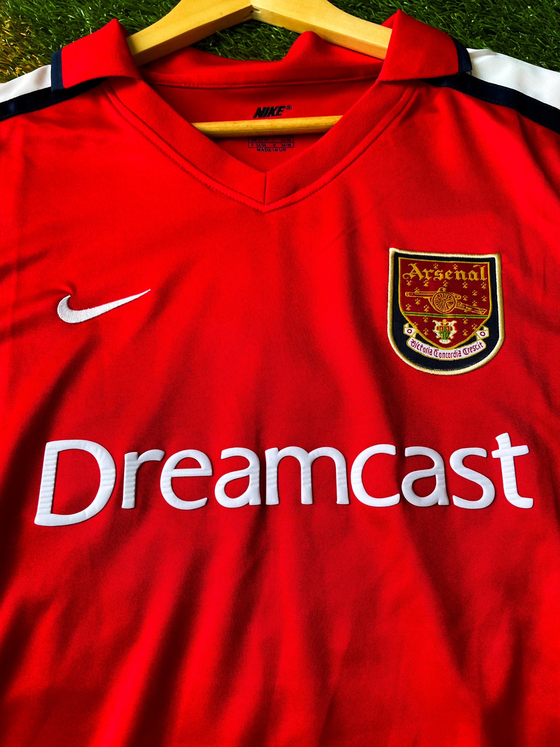 Close-up of Dreamcast sponsor and Nike swoosh on vintage Arsenal shirt

