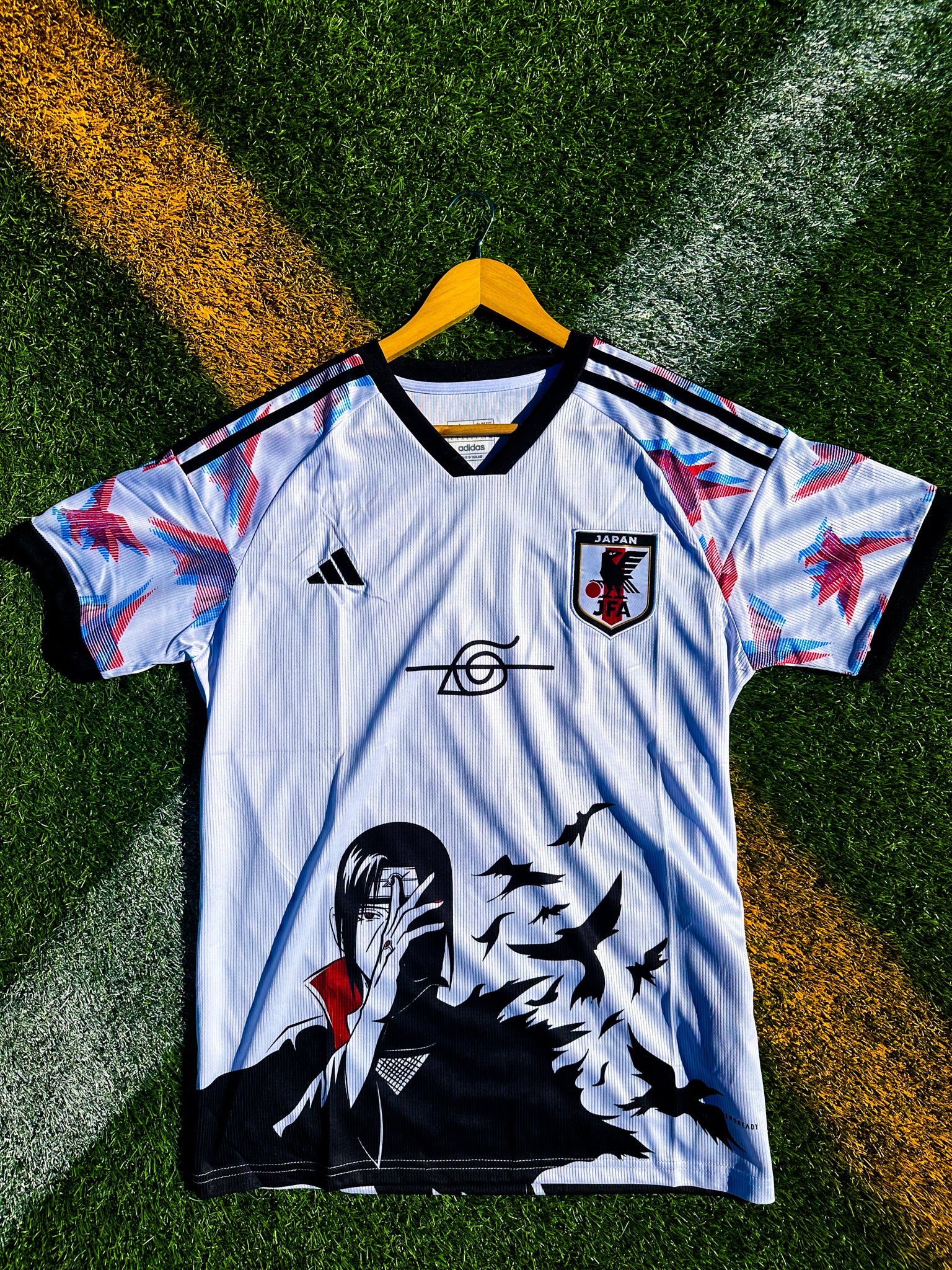 Front of Japan 2024 white Naruto jersey with anime design

