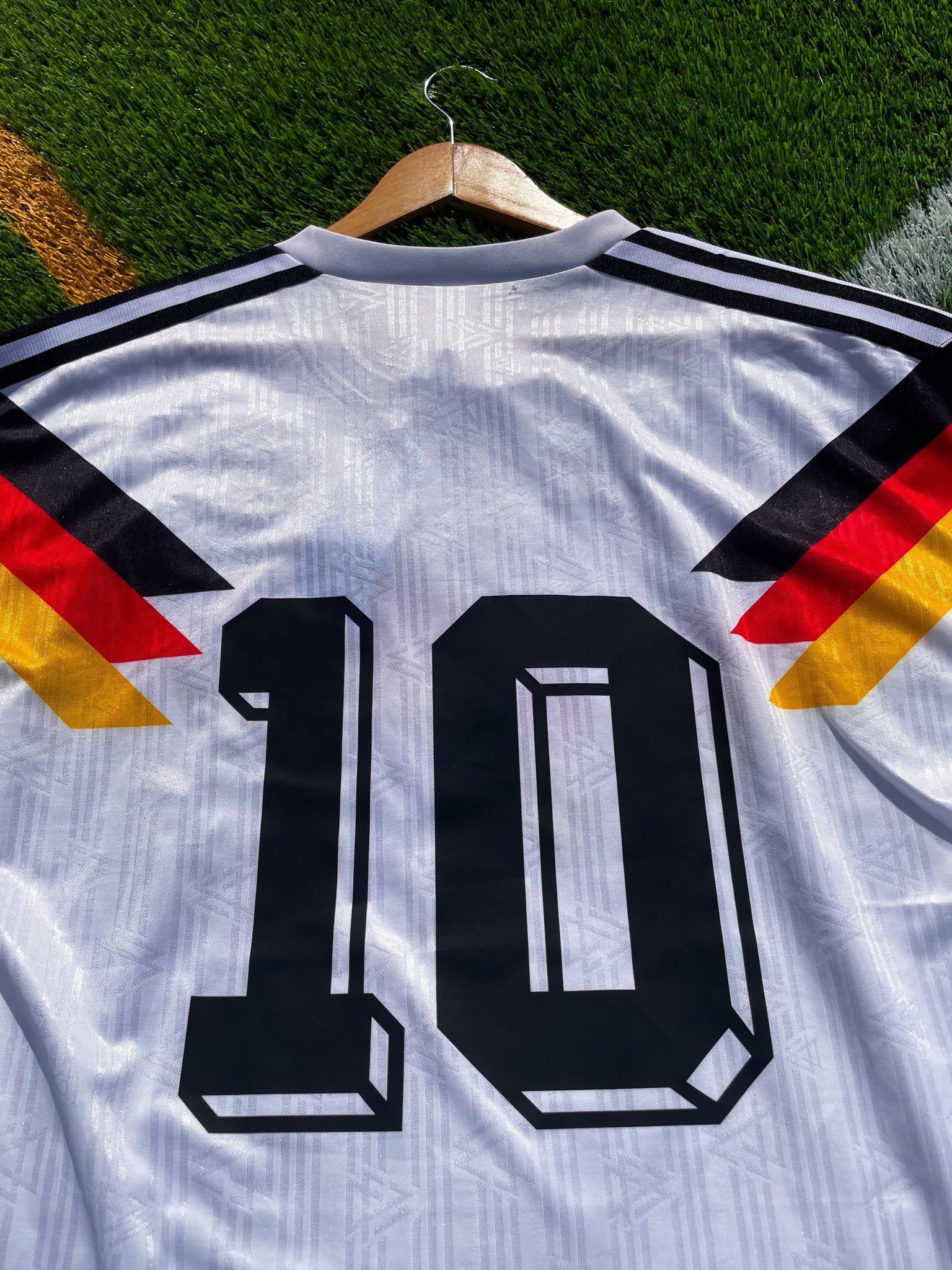 Back of the jersey featuring #10 in bold black font

