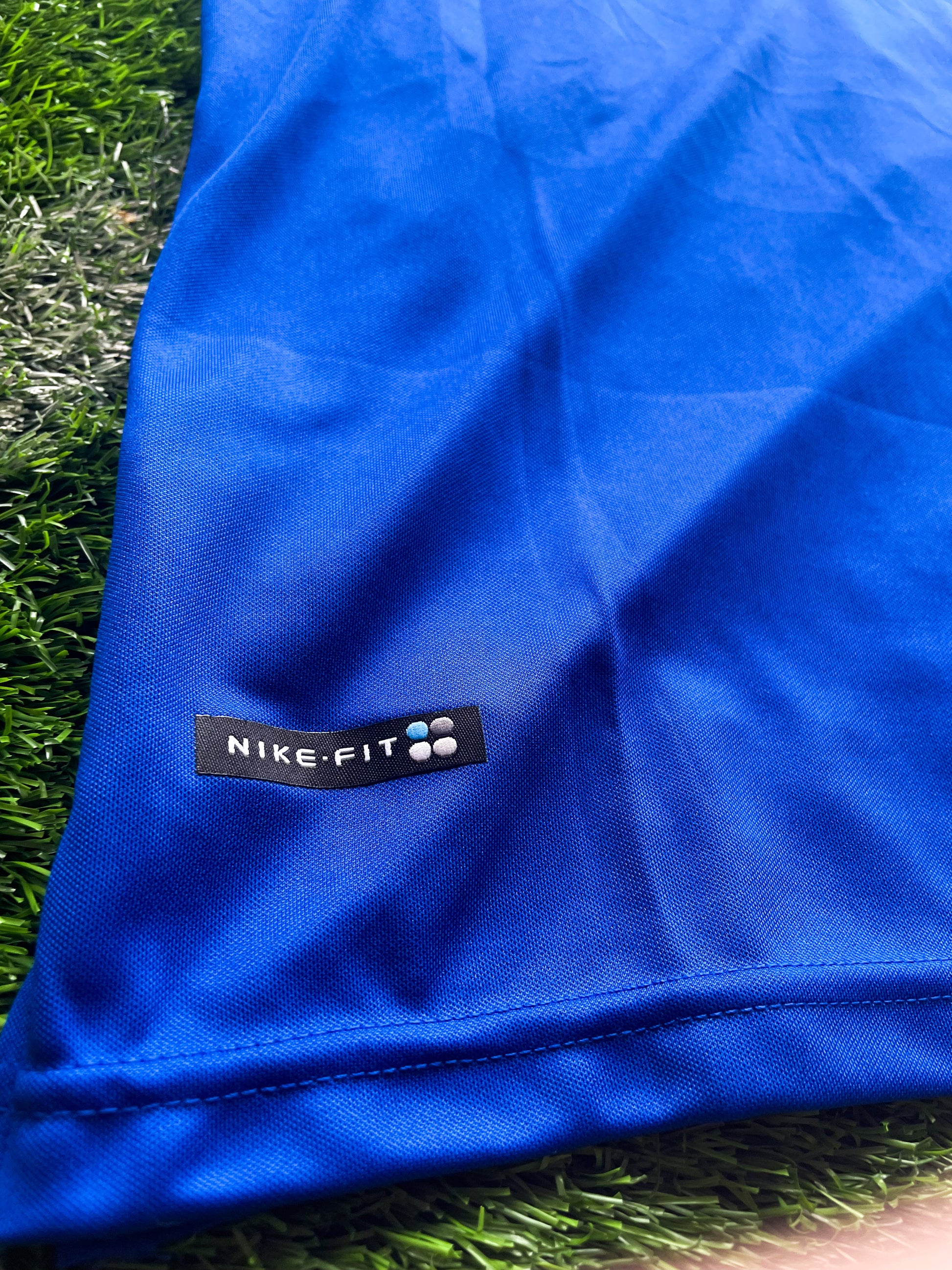 Detail shot of stitching and classic yellow trim on the vintage jersey