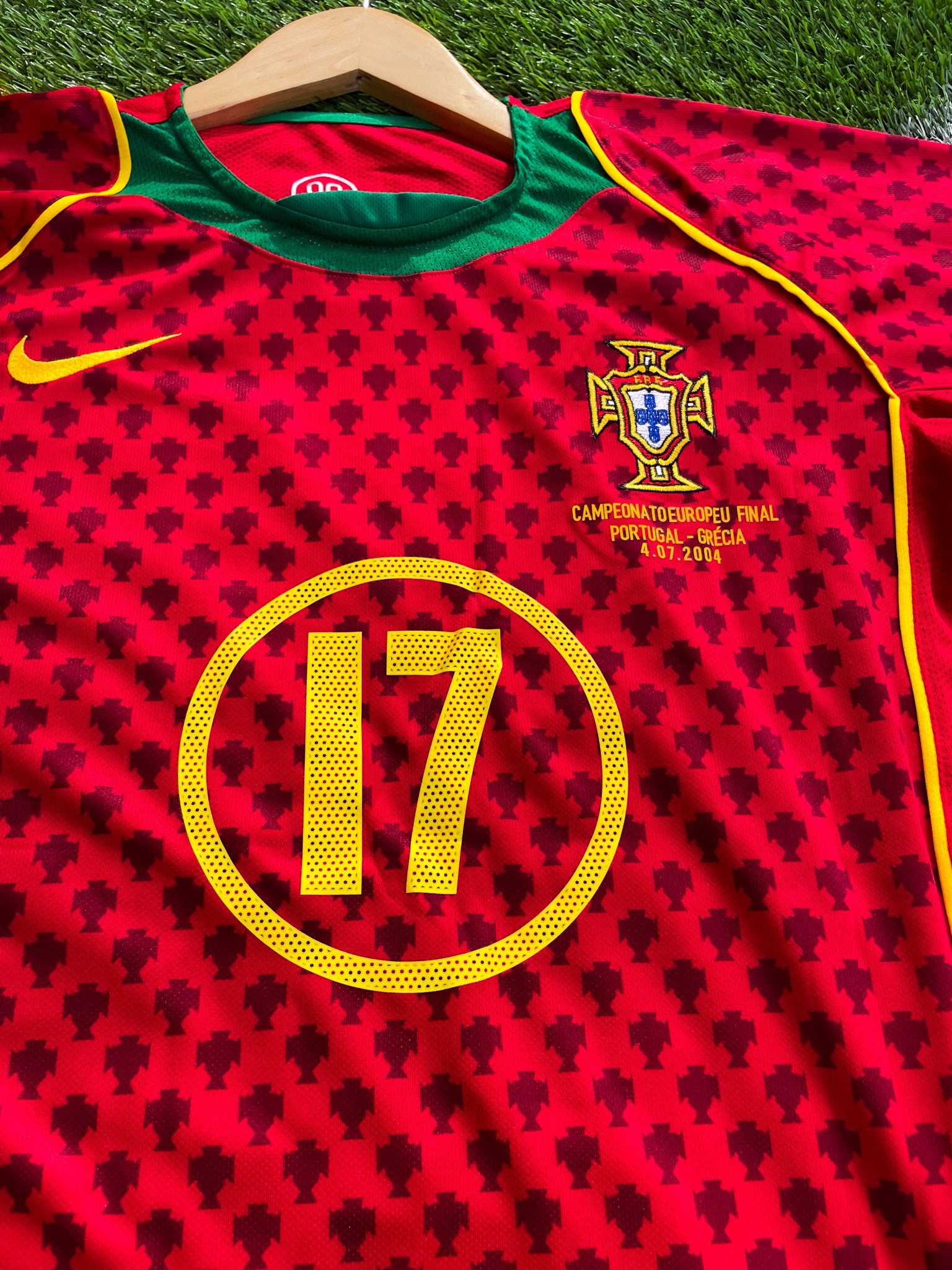 Close-up of Nike swoosh and Portuguese crest

