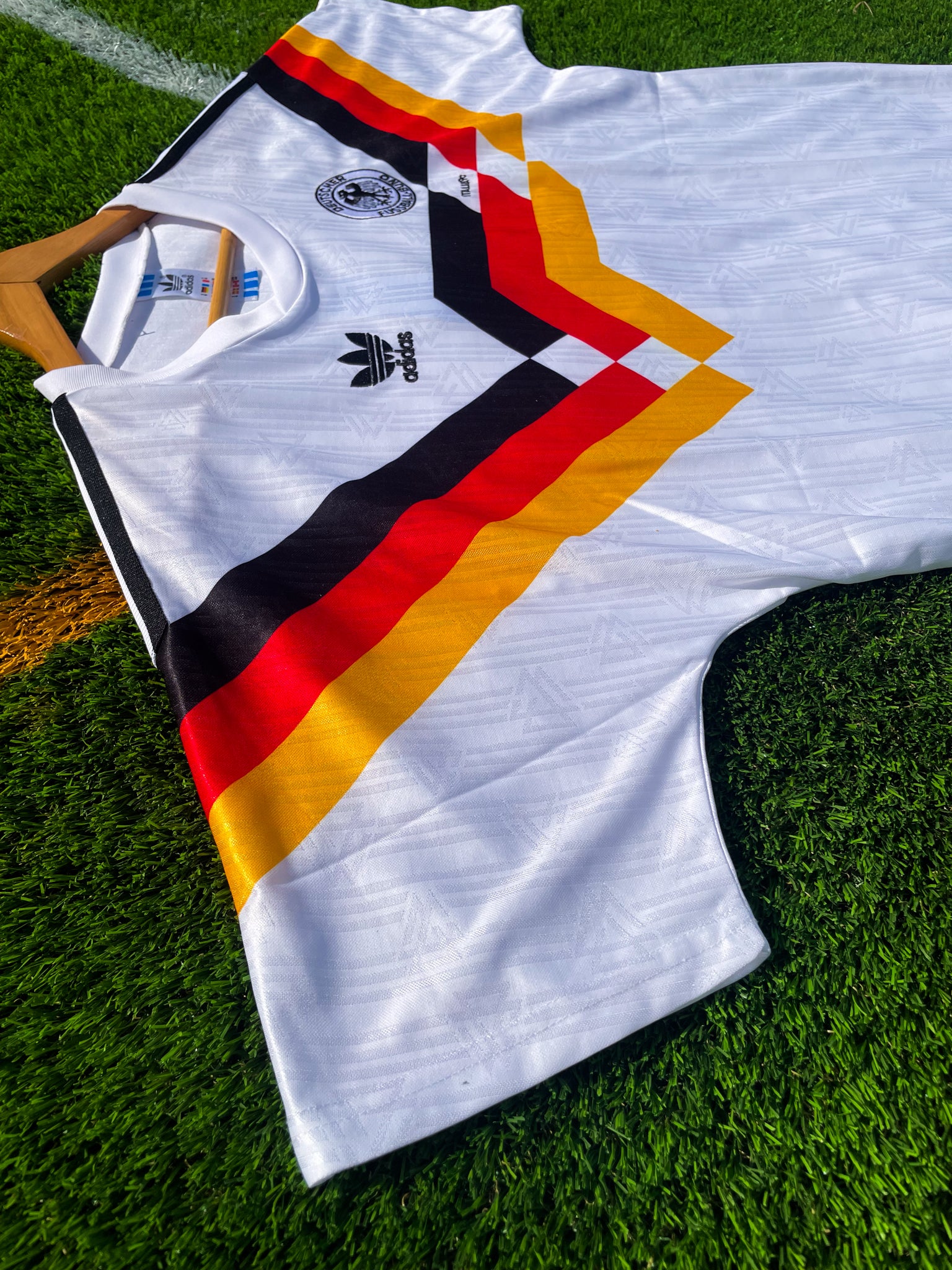 Close-up of DFB crest and Adidas shoulder logo

