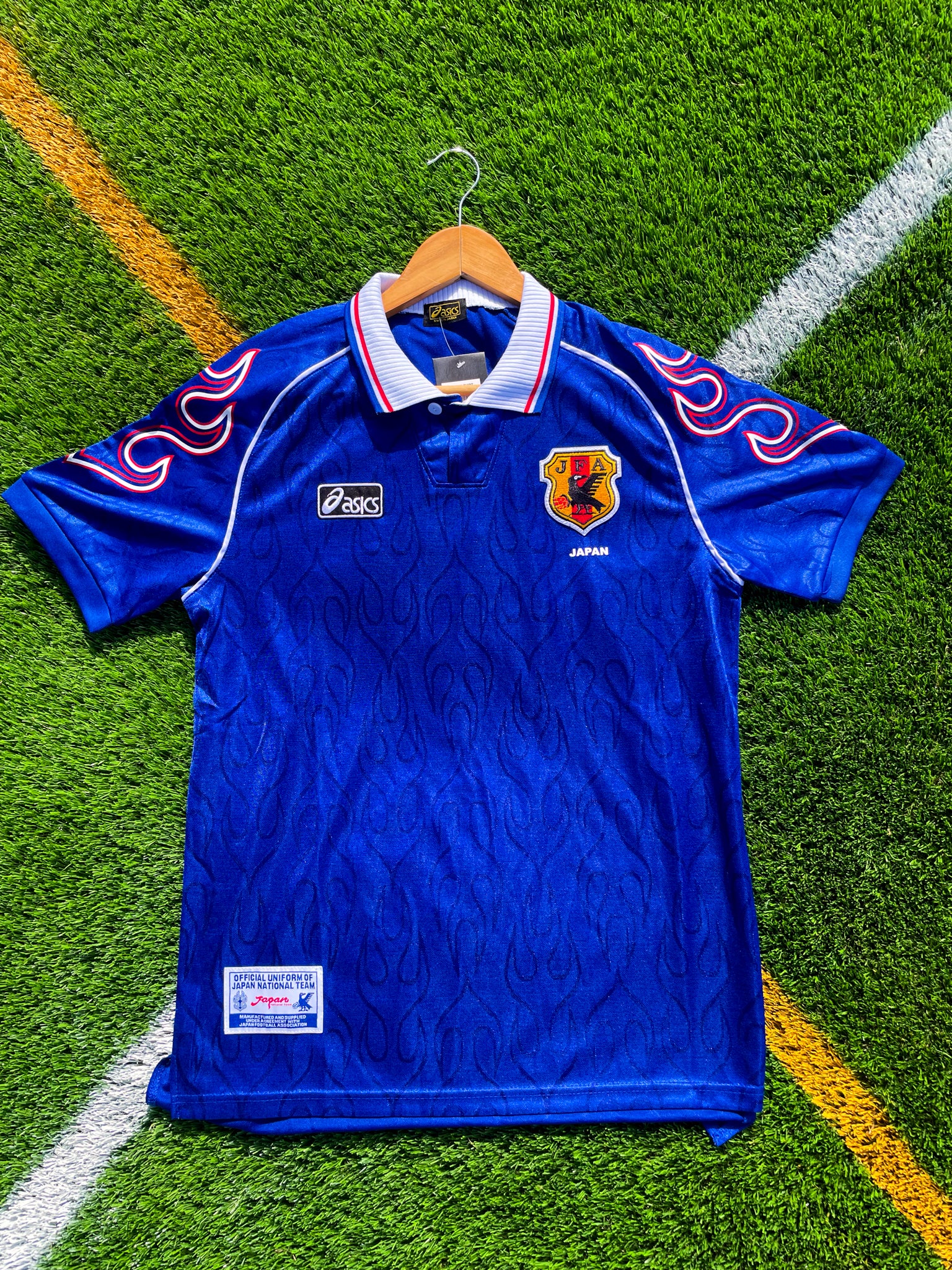 Front of Japan 1998 home jersey in classic blue with subtle patterns

