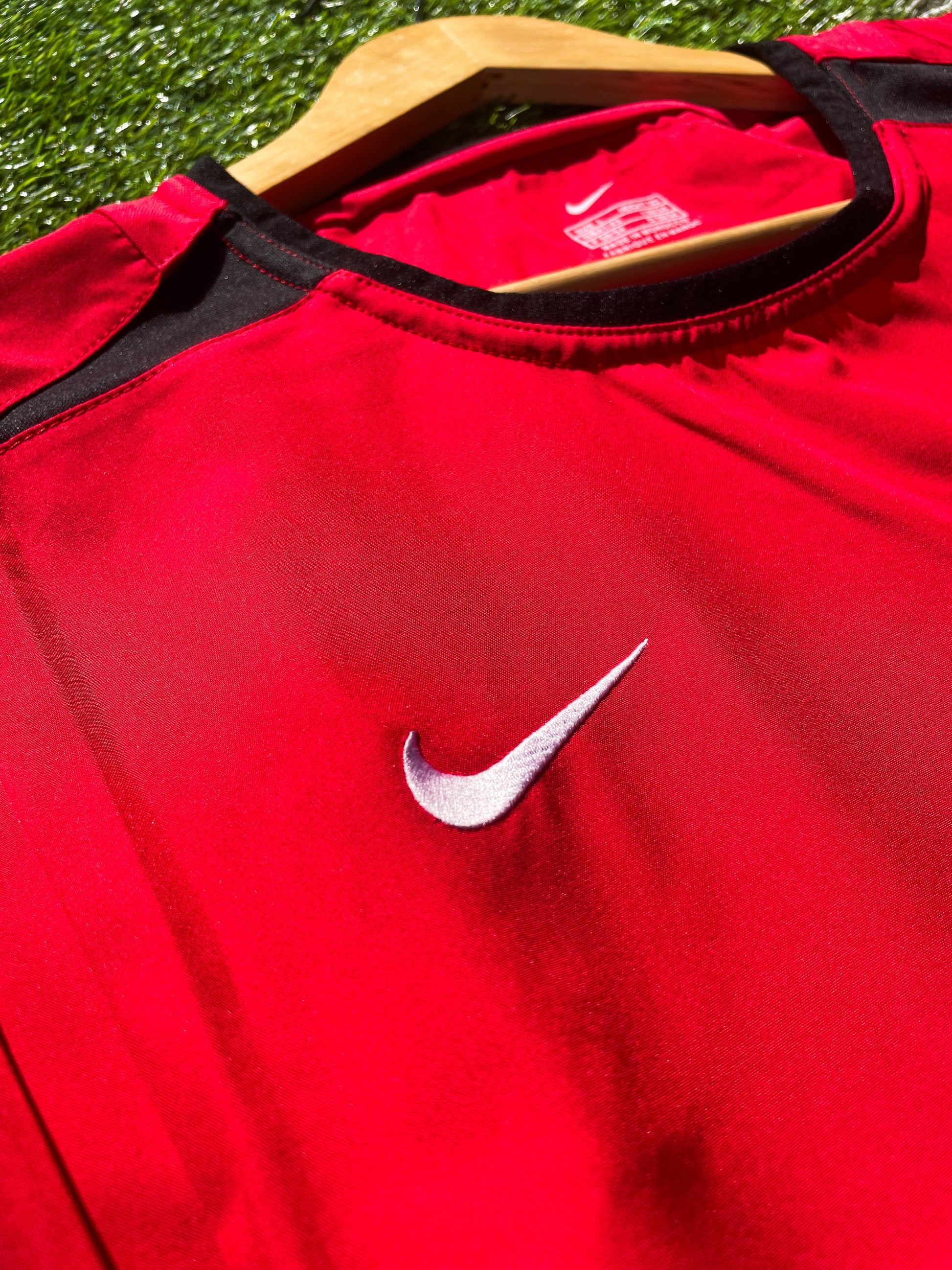 Close-up of embroidered club crest and Nike swoosh

