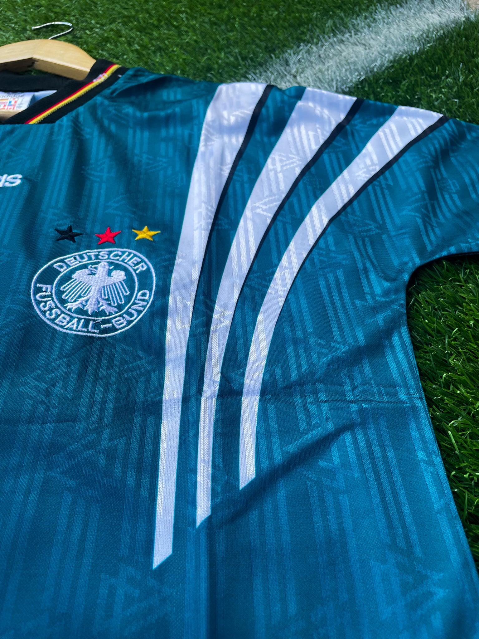 Close-up of DFB crest and Adidas logo

