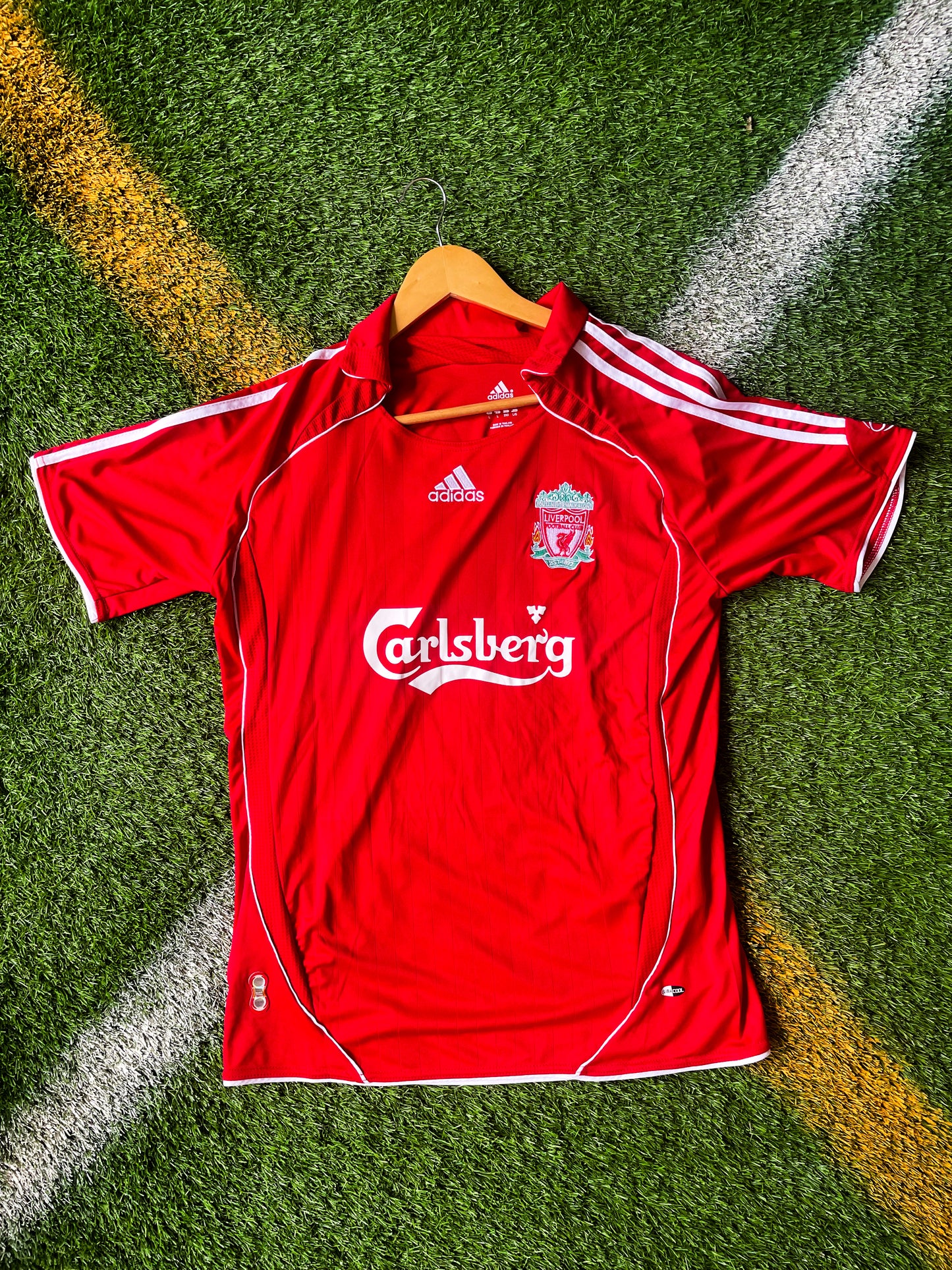 Front view of Liverpool 2006 Home Jersey in red with Adidas and sponsor logos

