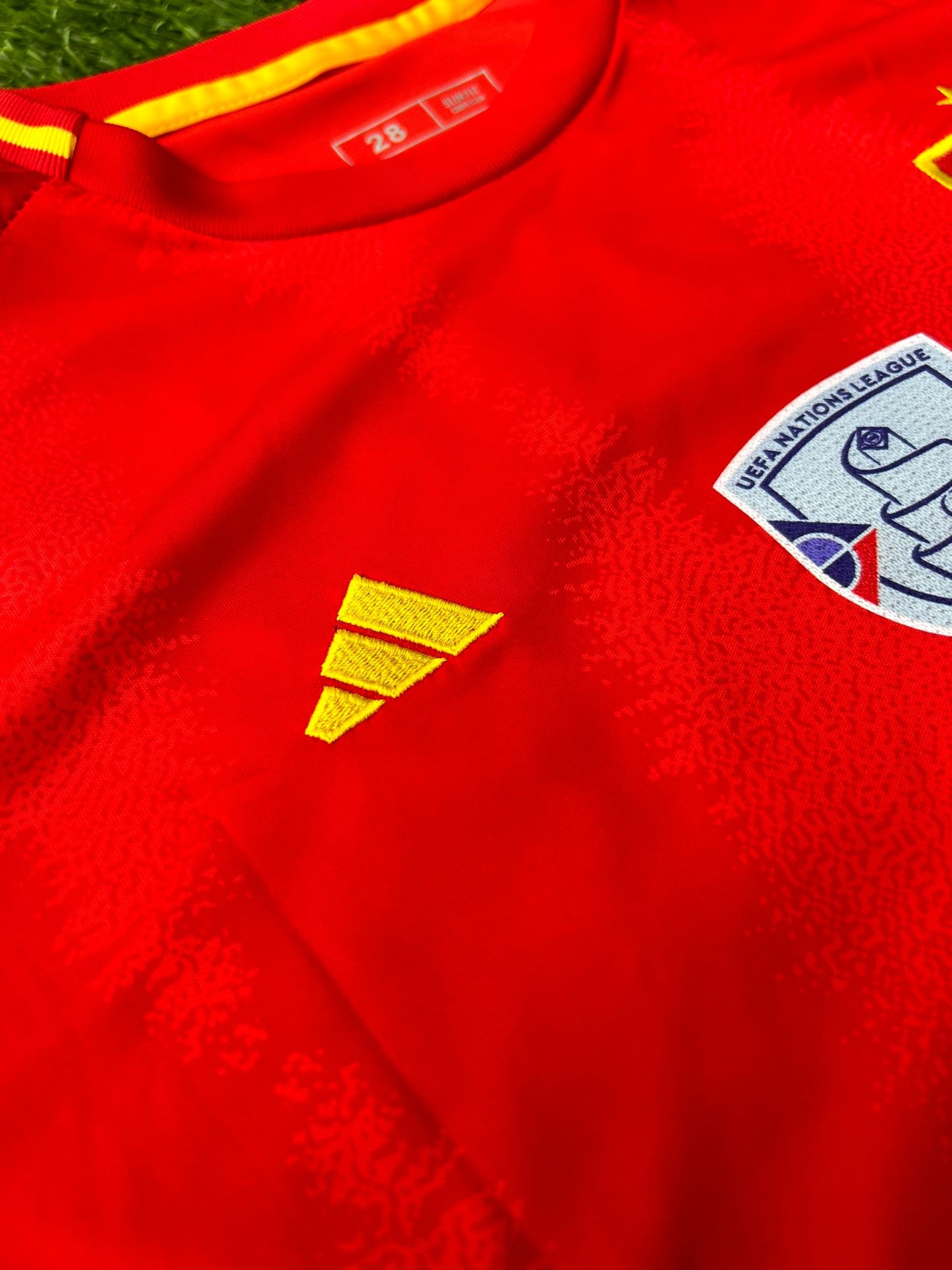 Close-up of RFEF crest and modern jersey texture

