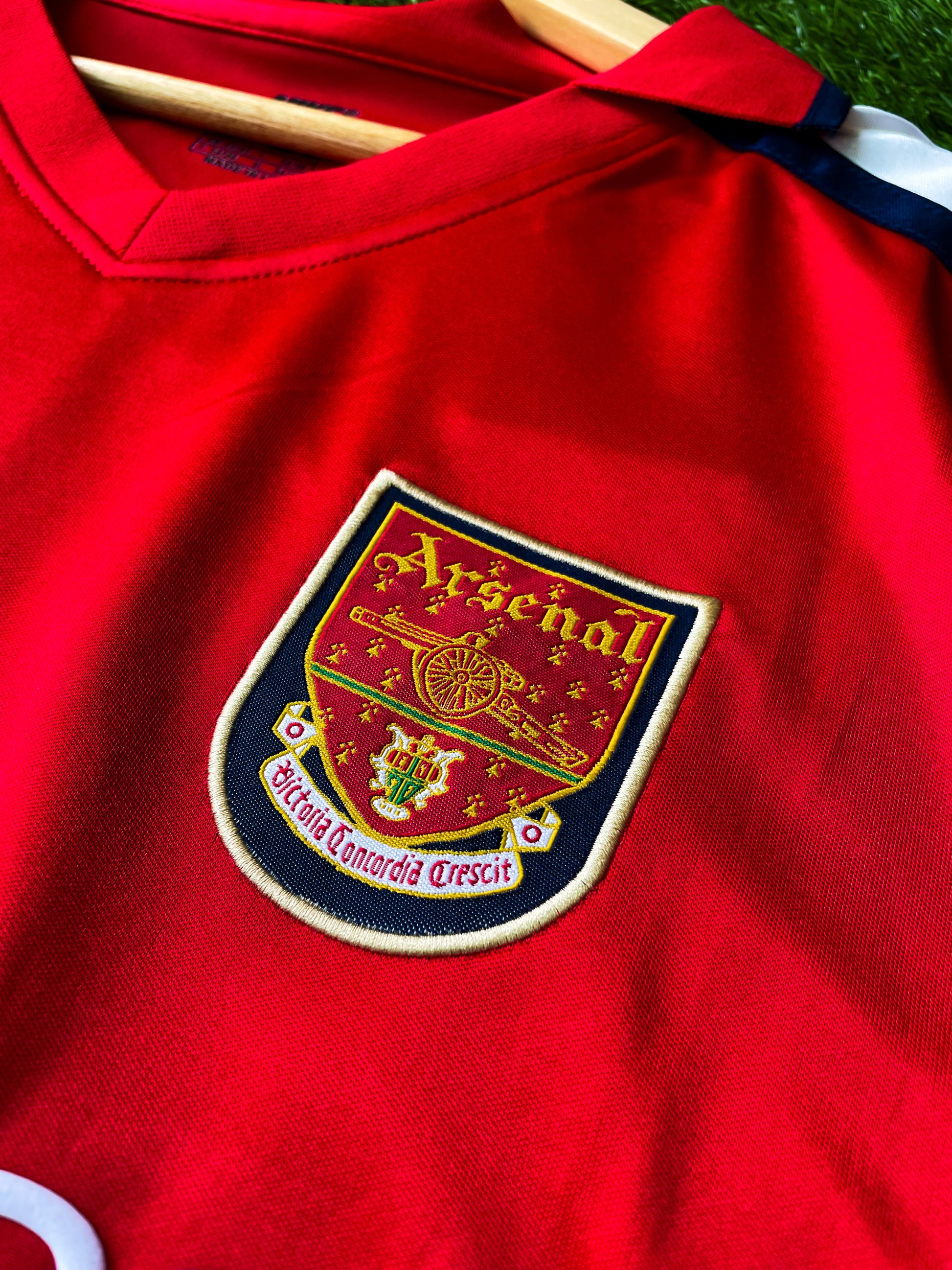 Close-up of Dreamcast sponsor and Nike swoosh on vintage Arsenal shirt

