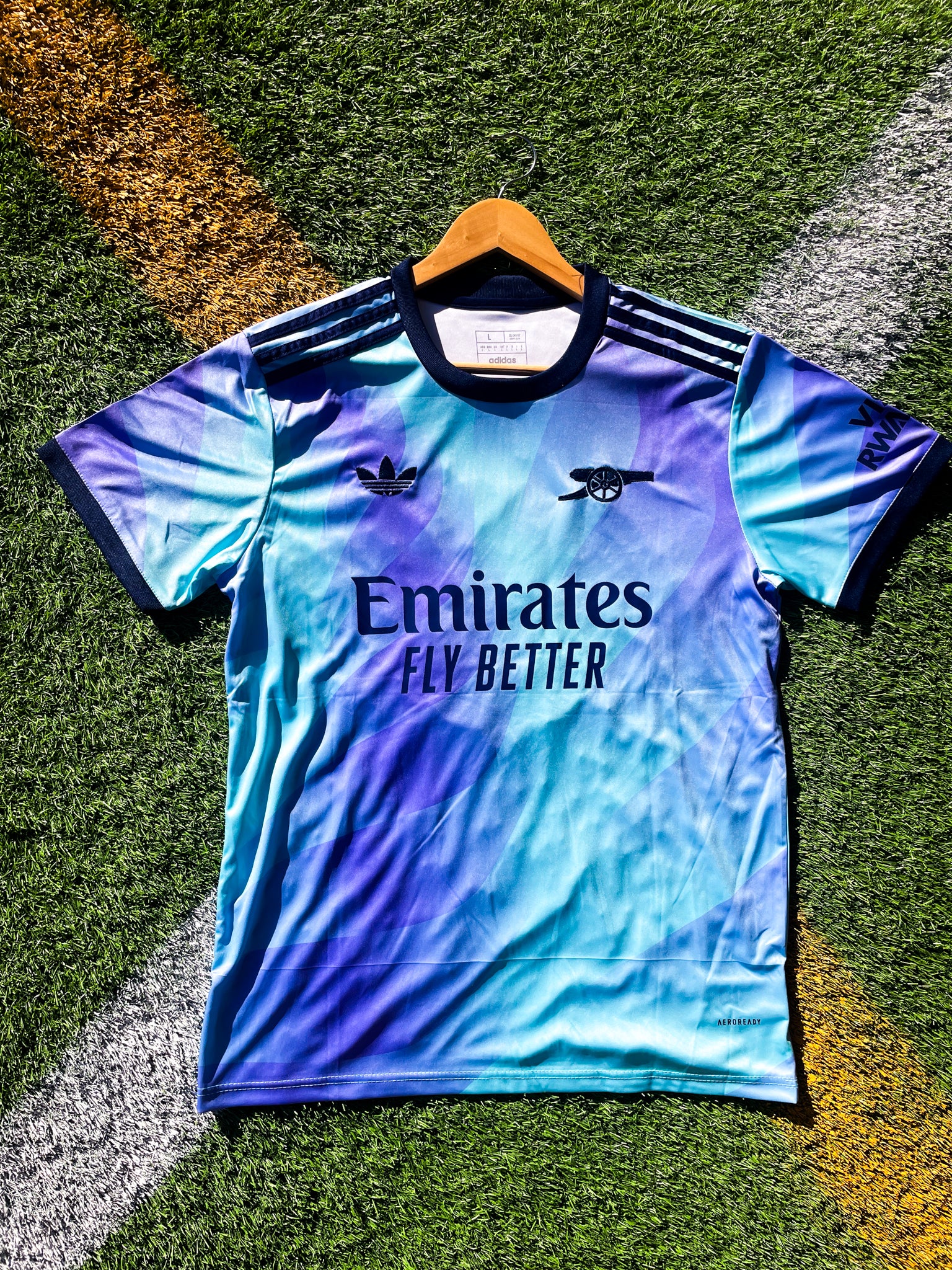 Front view of Arsenal 2024–2025 Third Jersey in blue and purple with Adidas logo

