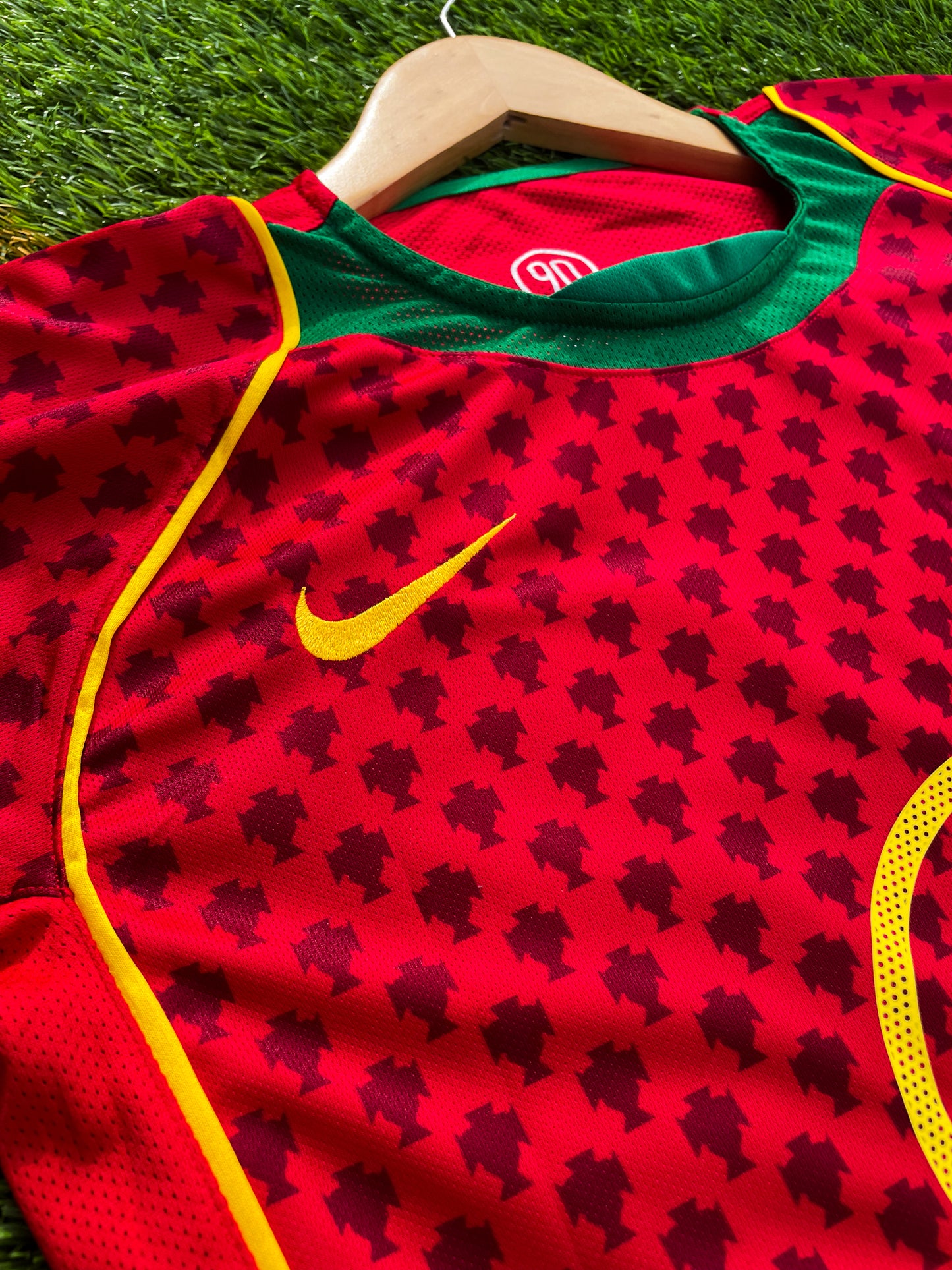 Close-up of Nike swoosh and Portuguese crest

