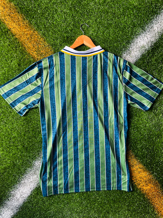 Back view showing clean green layout and classic fit

