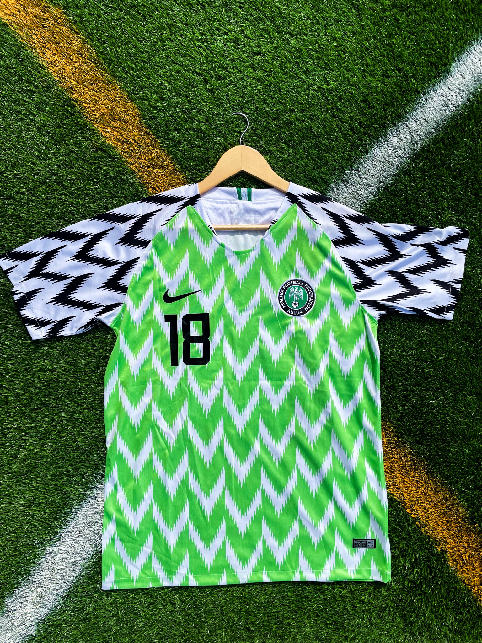 Front of Nigeria 2018 home jersey with neon zig-zag pattern

