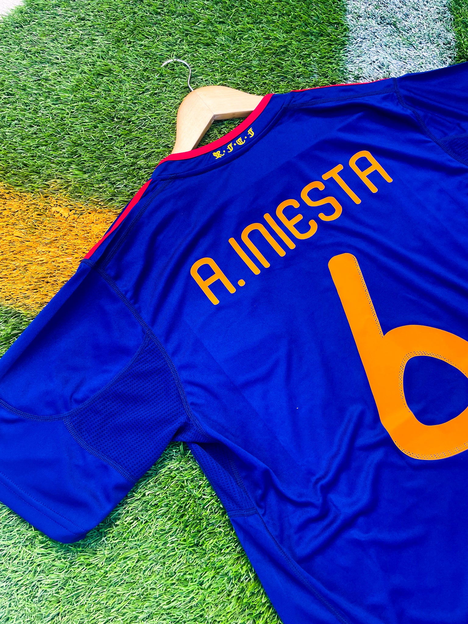 Back view featuring Iniesta name and number on navy blue jersey

