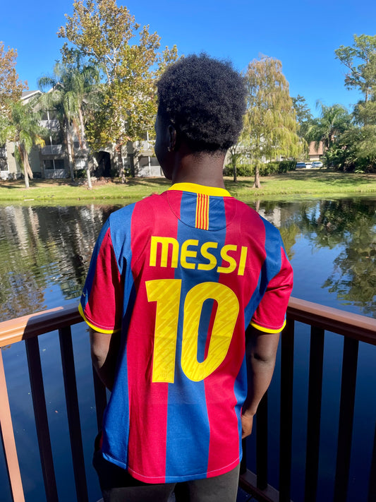 Messi #10 Barcelona shirt styled on neutral background

