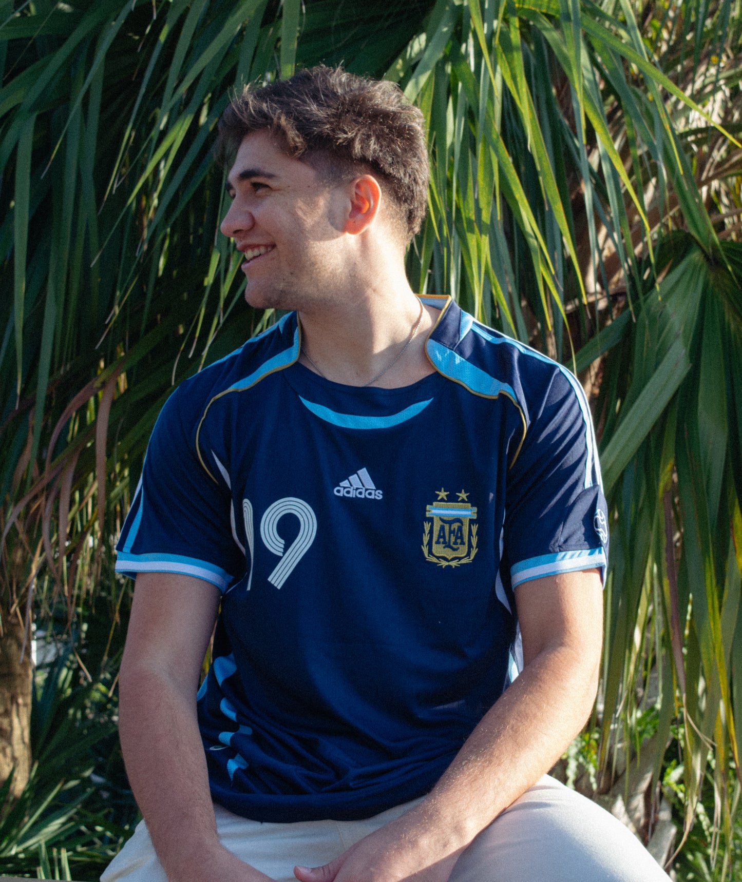Model wearing the Argentina 2006 Away Messi #19 Jersey, styled with complementary accessories.