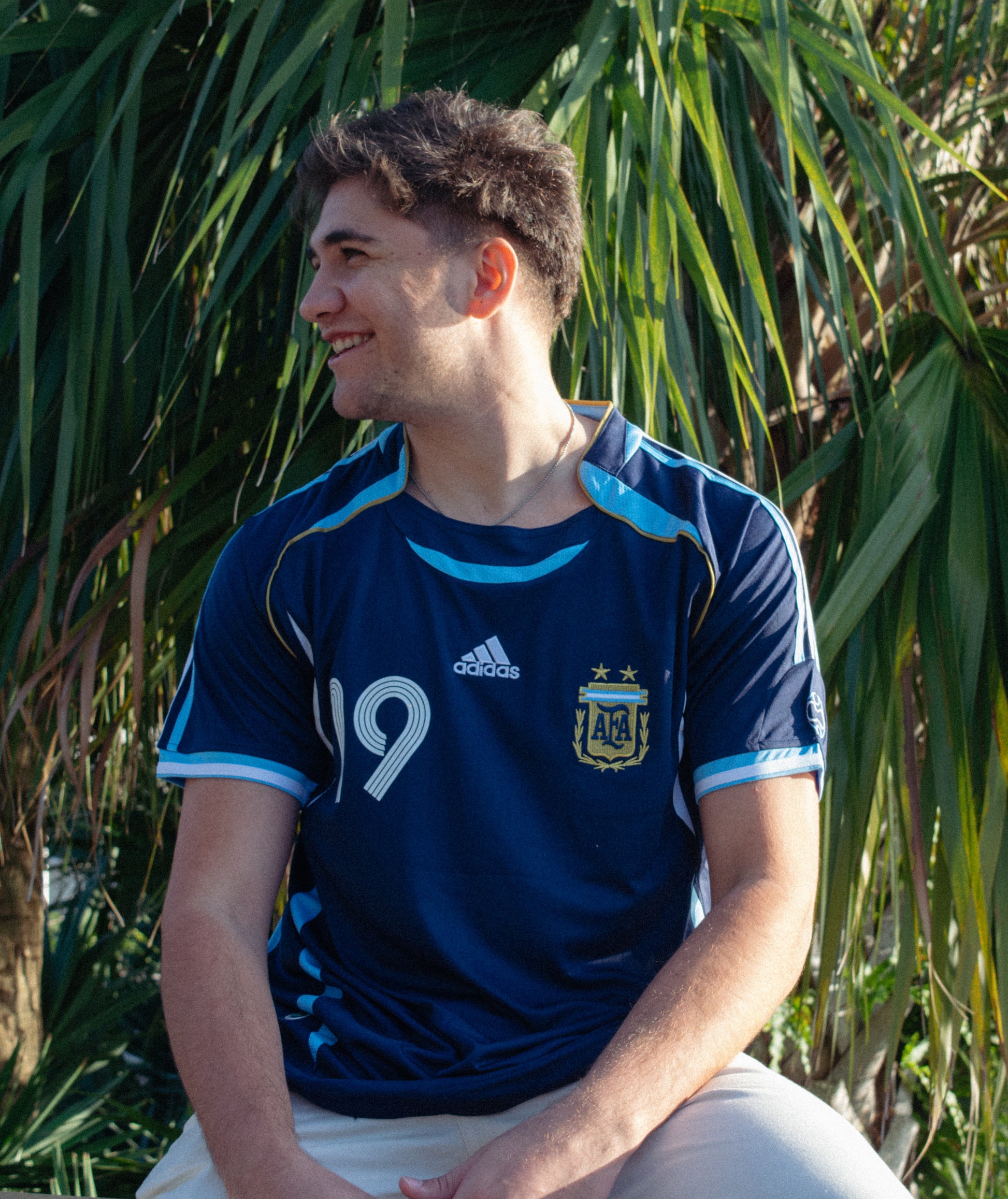 Model wearing the Argentina 2006 Away Messi #19 Jersey, styled with complementary accessories.