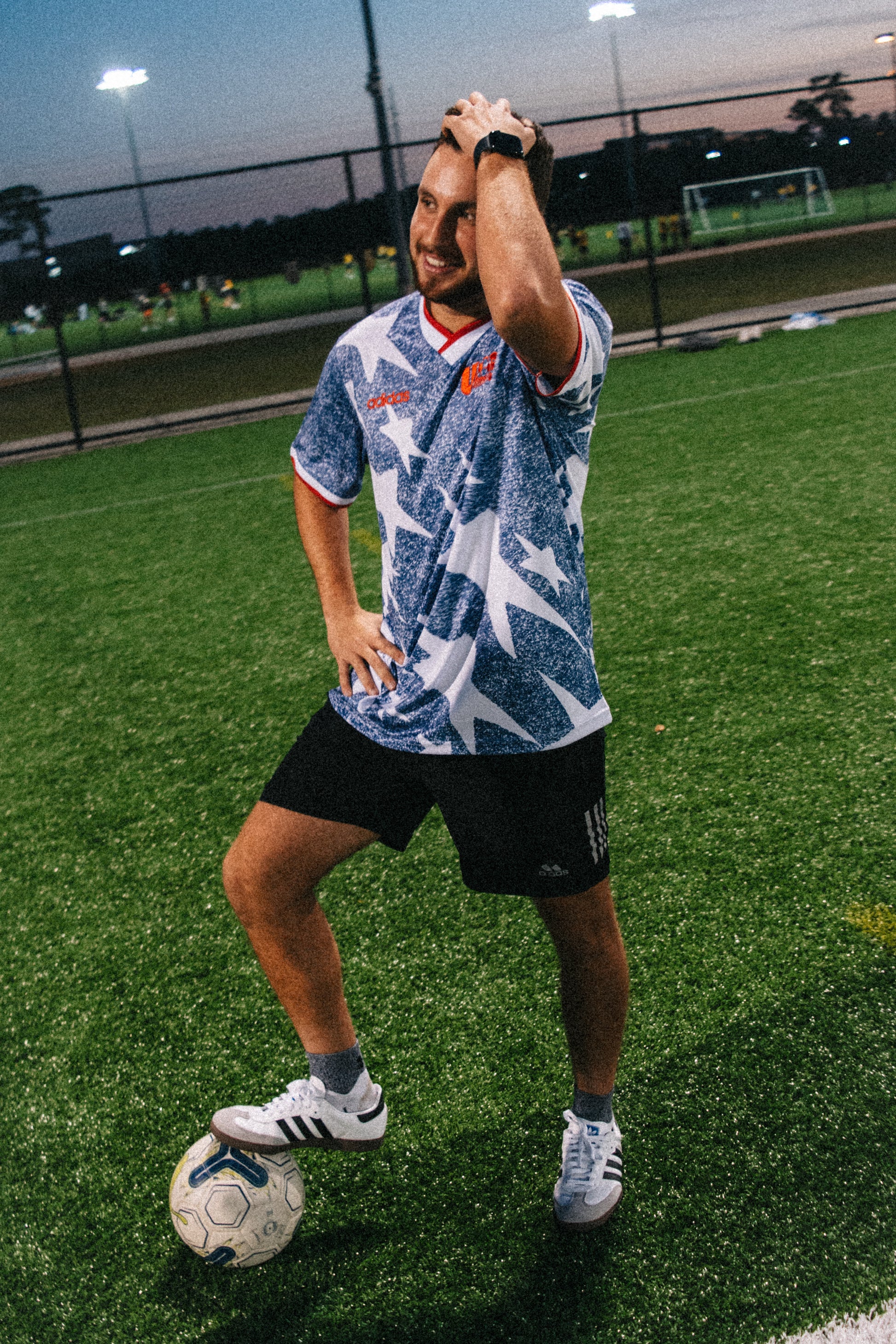 Styled model wearing the USA 1994 grey jersey with retro-inspired outfit

