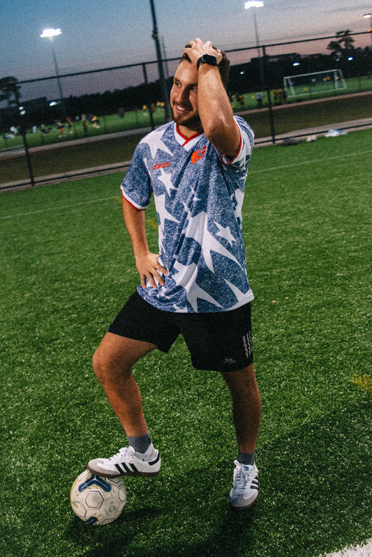 Styled model wearing the USA 1994 grey jersey with retro-inspired outfit

