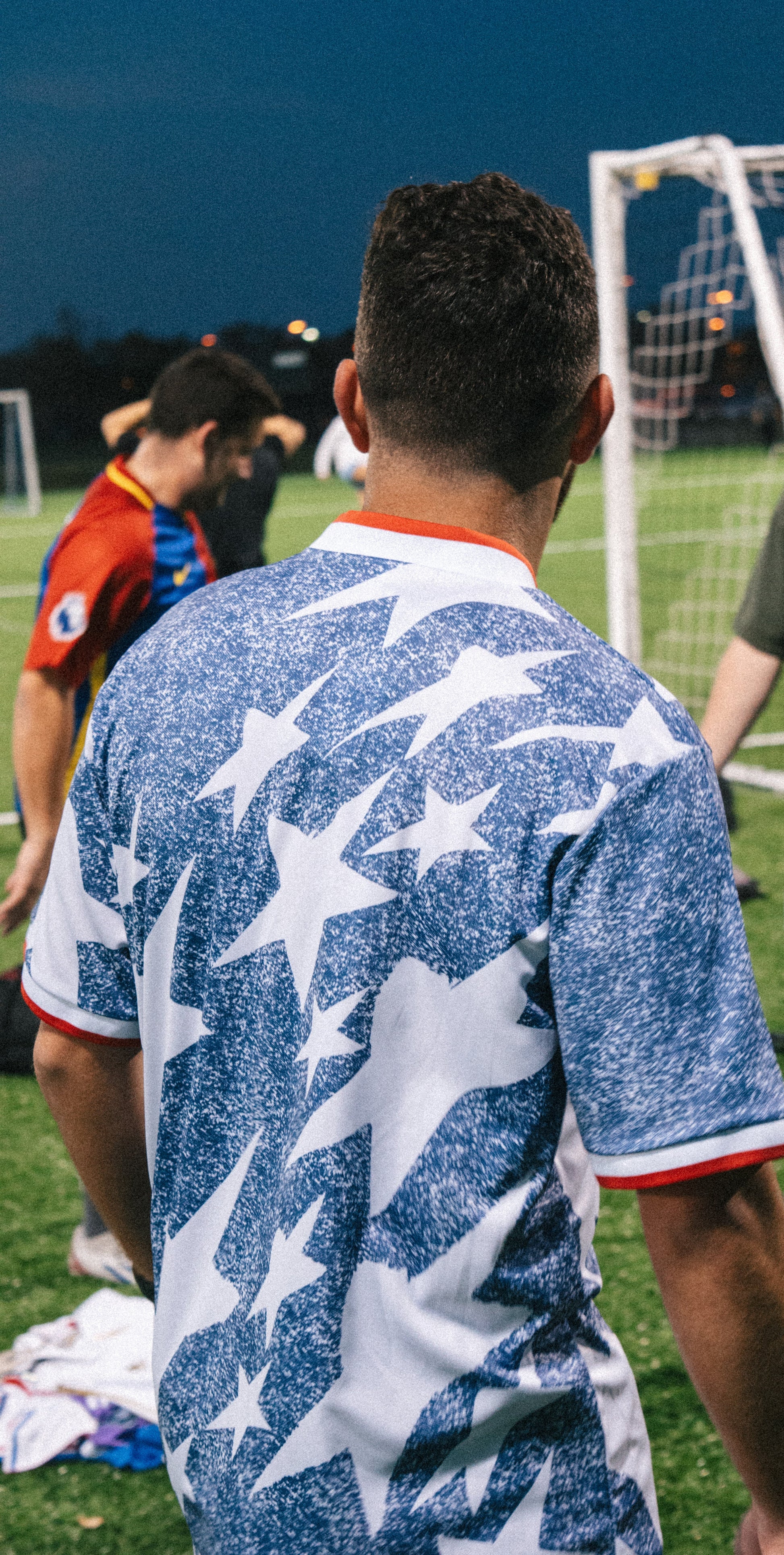 Styled model wearing the USA 1994 grey jersey with retro-inspired outfit

