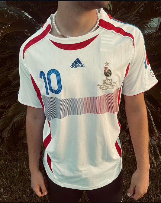 Model wearing France 2006 away jersey styled with sneakers and jeans