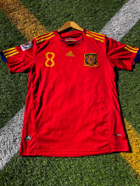 Front view of Spain 2010 home jersey in red with gold trim