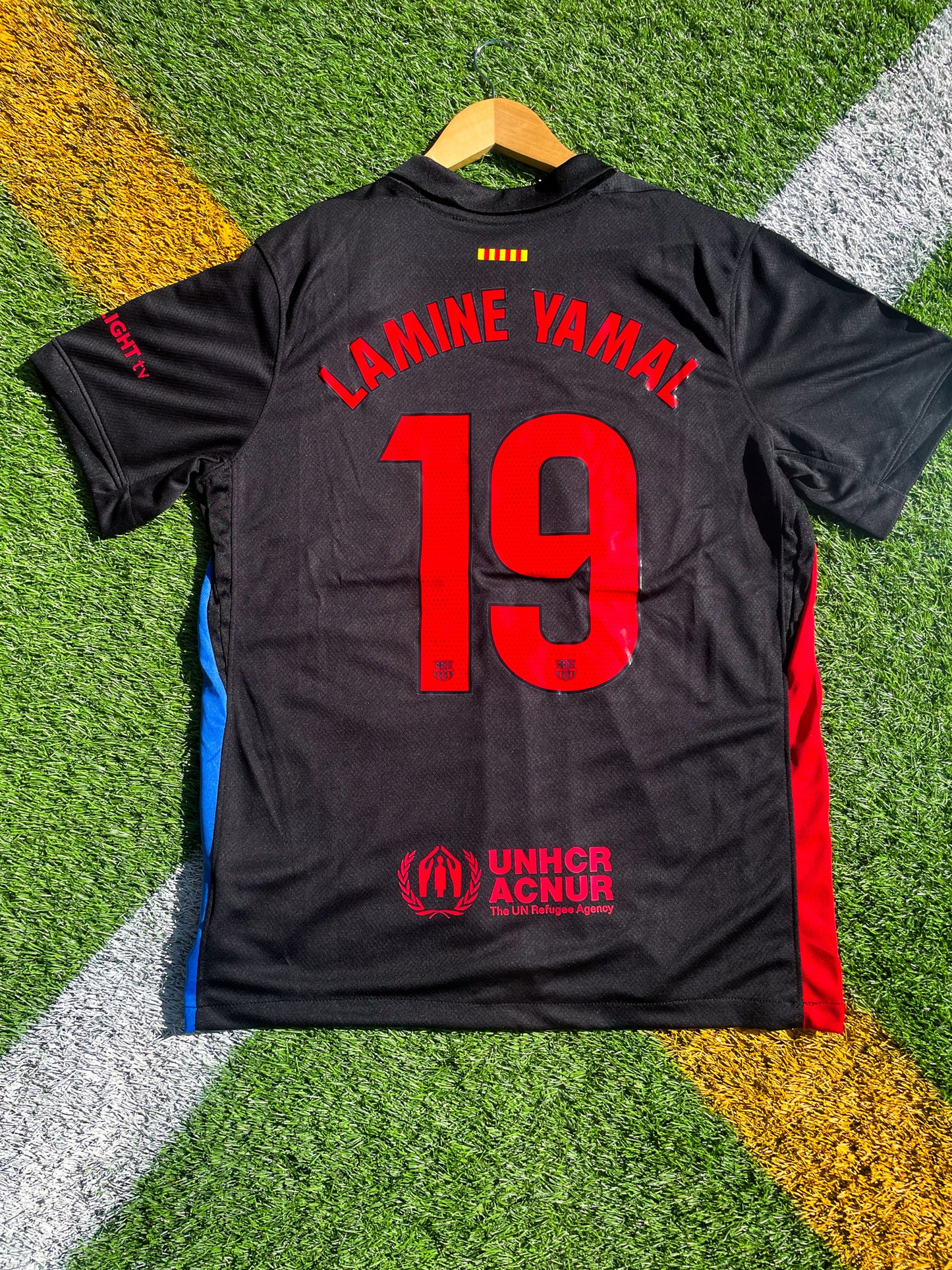 Back view of Barcelona 2024/25 away jersey with Nike logo and club crest, inspired by Cactus Jack streetwear aesthetics