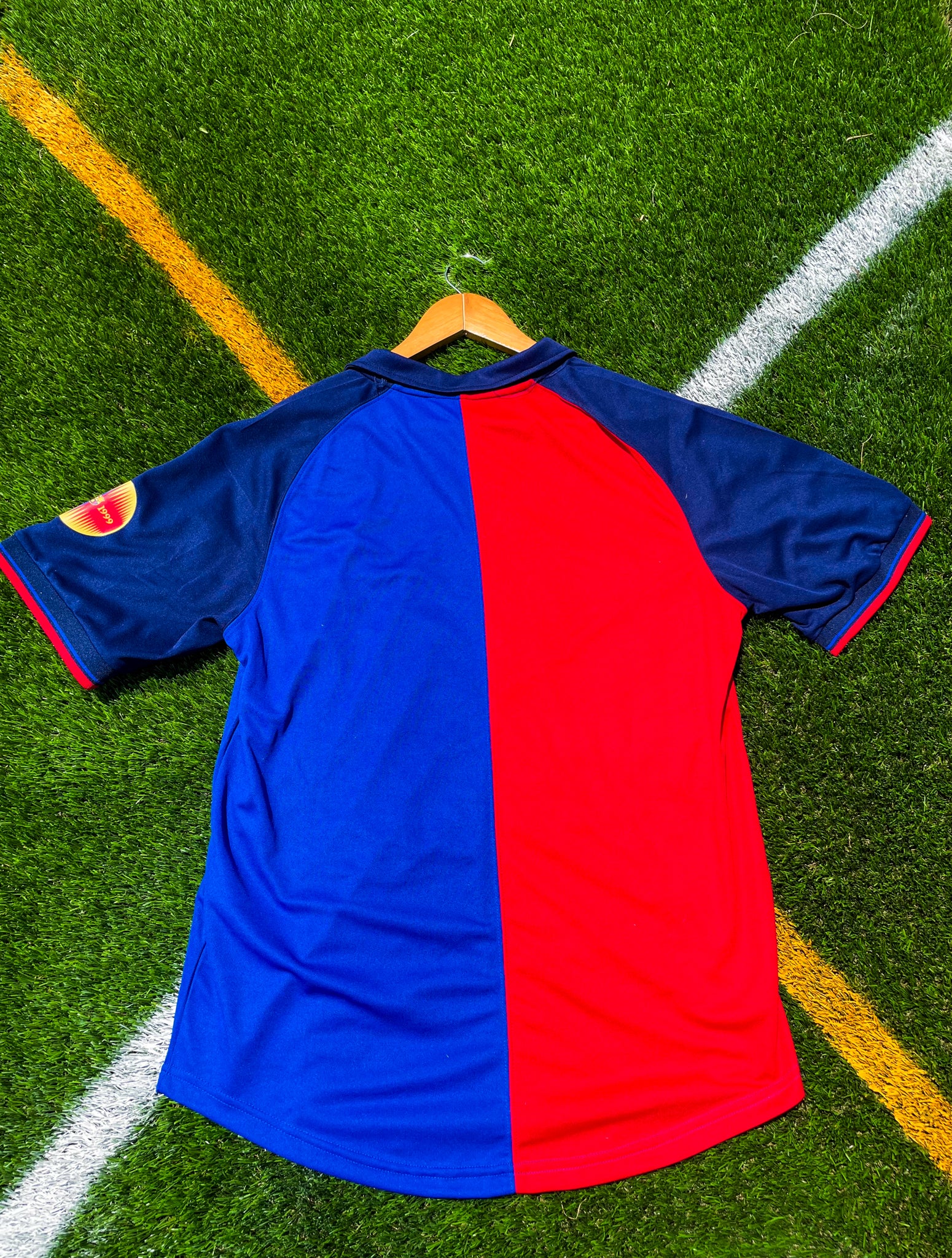 Back of the jersey showing classic red and blue stripes

