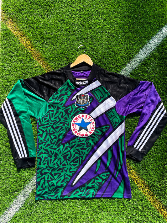 Front view of Newcastle United 1995–96 goalkeeper jersey with bold purple and green pattern